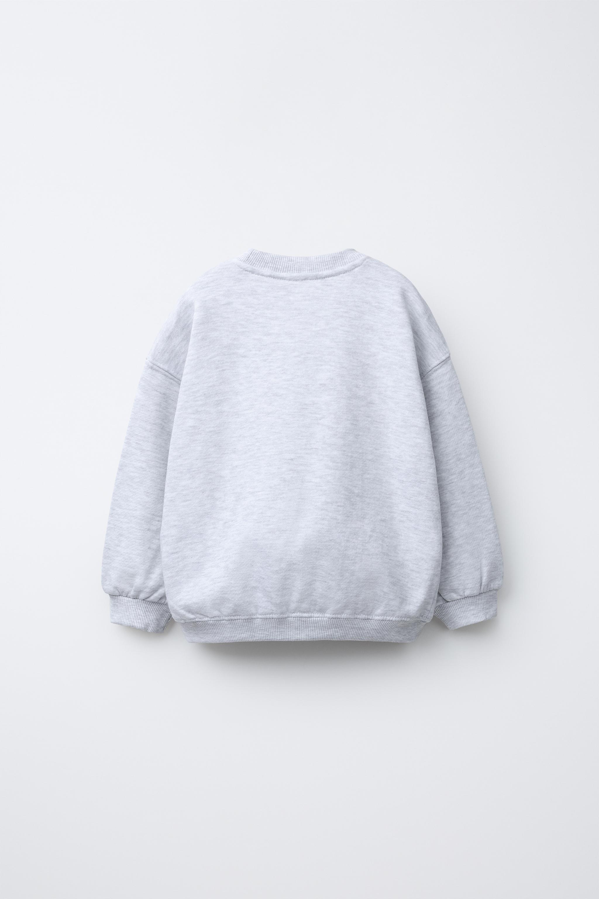 RAISED TEXT SWEATSHIRT