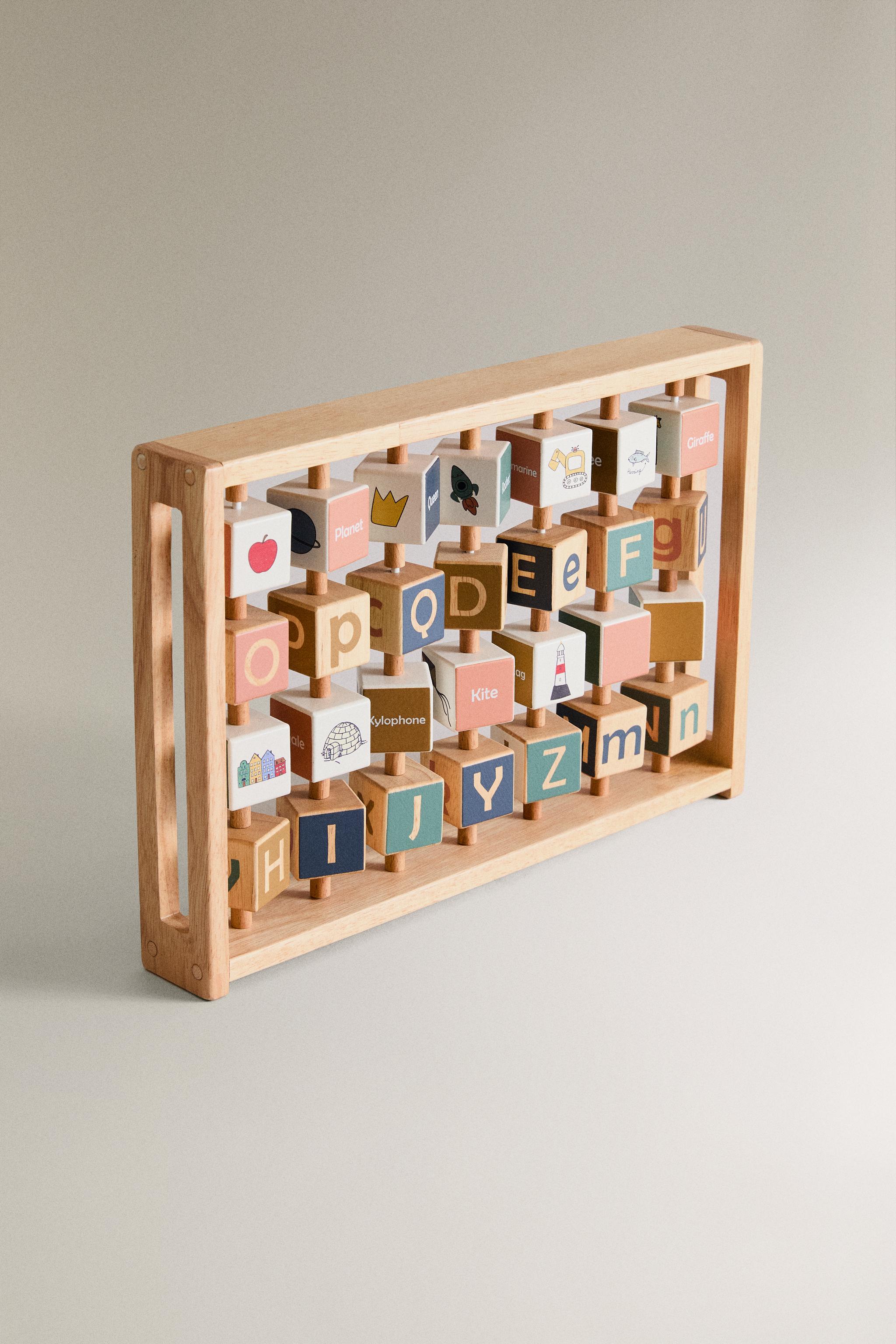 CHILDREN’S WOODEN ALPHABET TOY