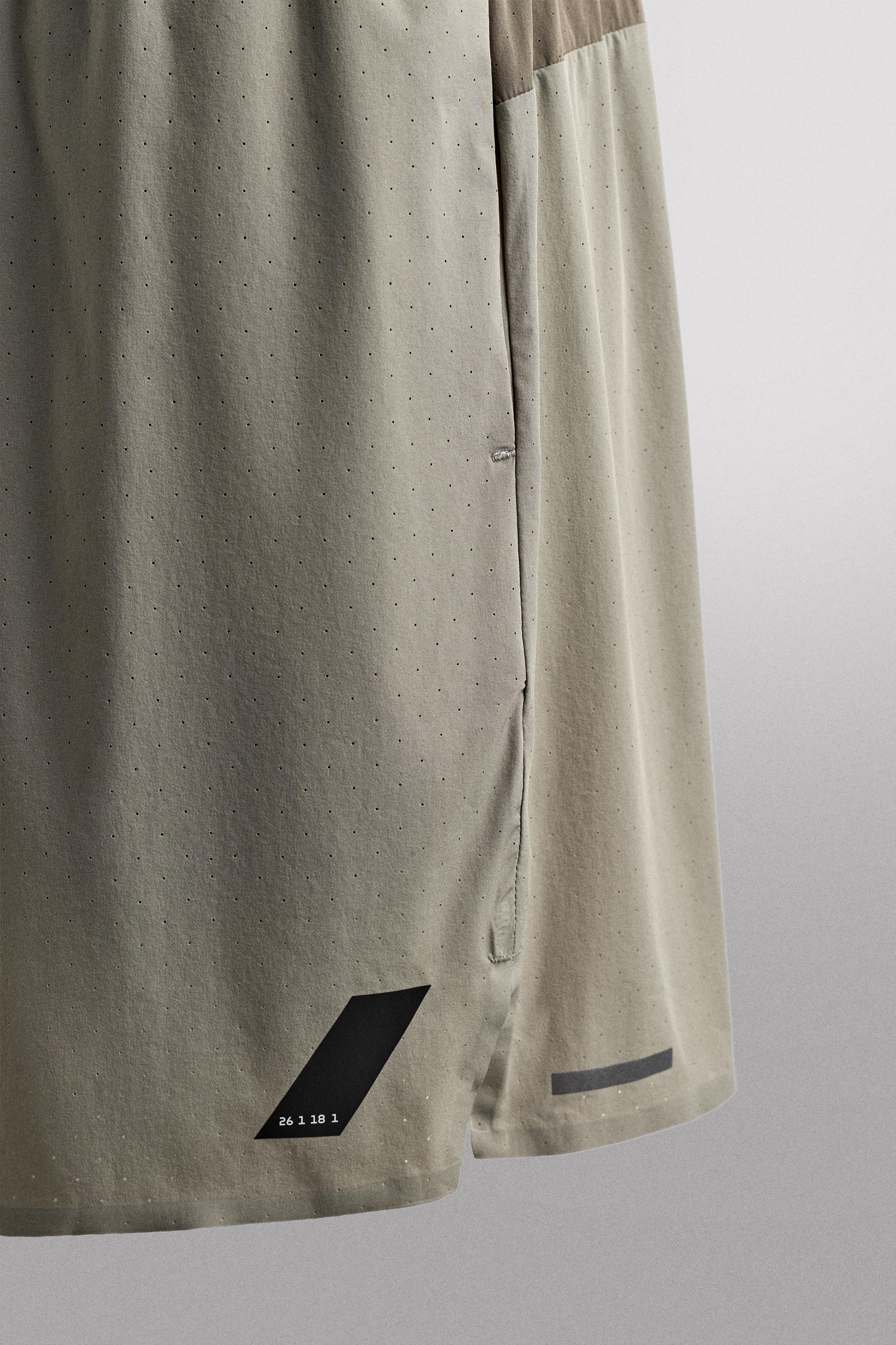 LIGHTWEIGHT PERFORATED SHORTS