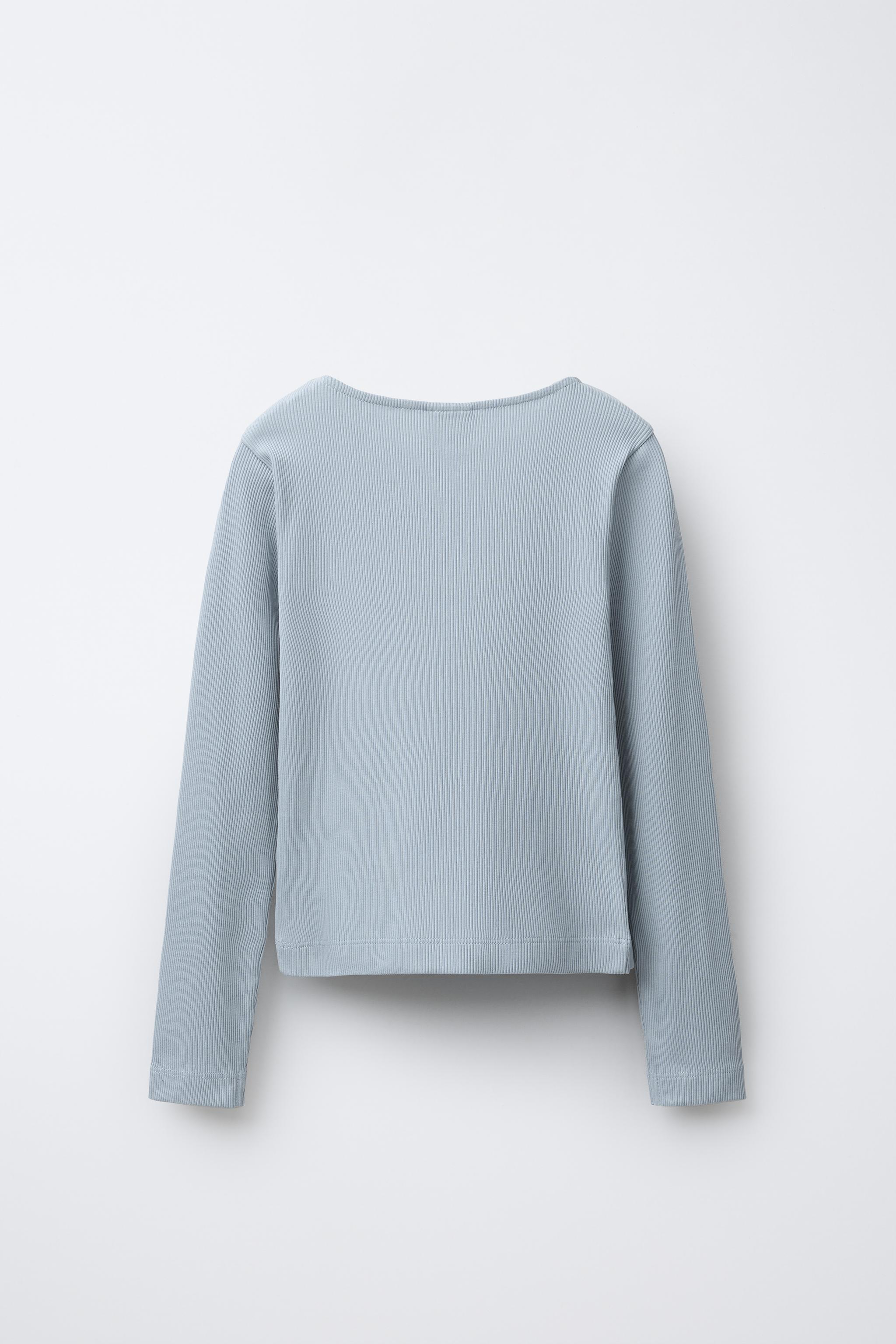 RIBBED T-SHIRT WITH BUTTONS AND CUT-OUT