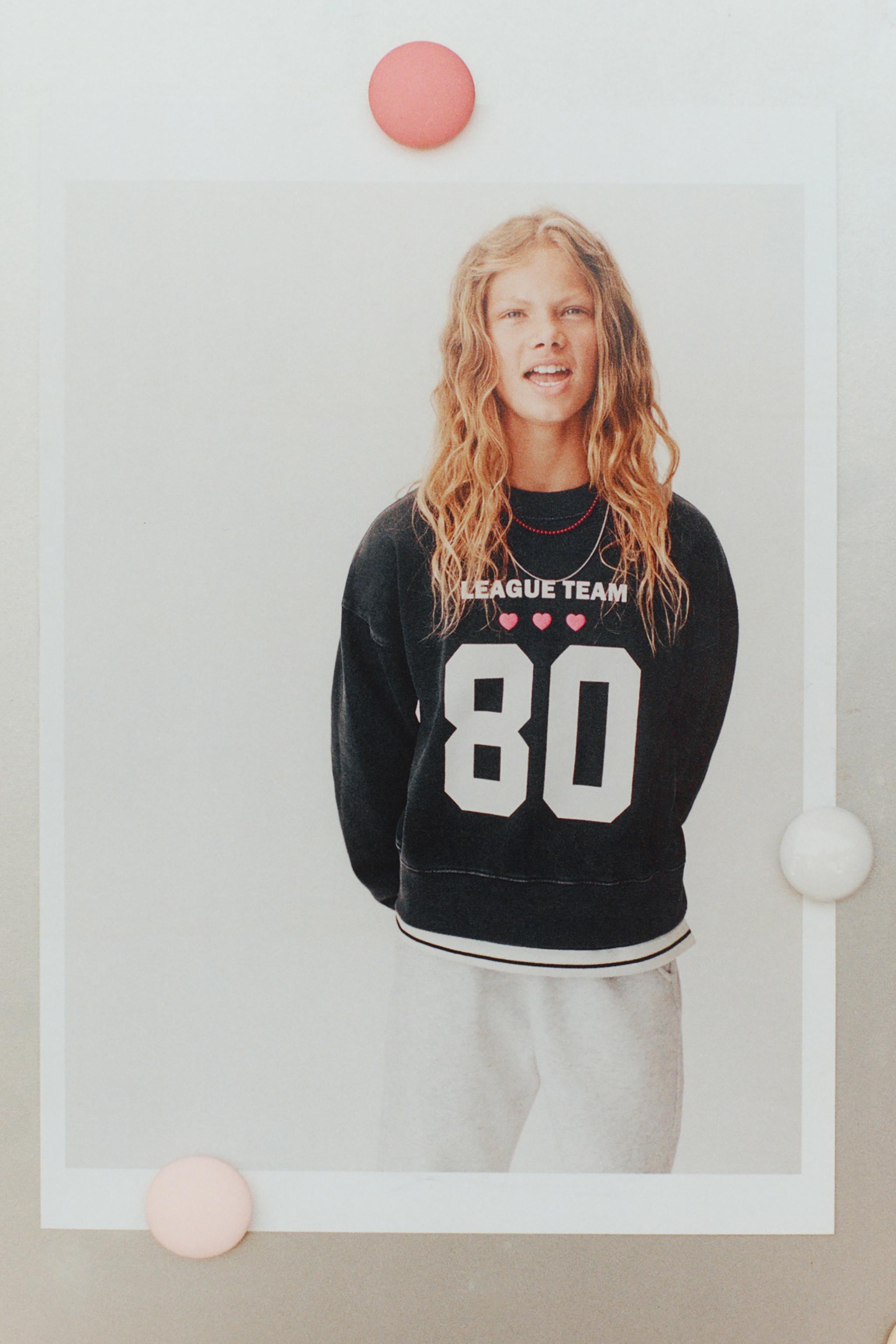 VARSITY PRINT SWEATSHIRT