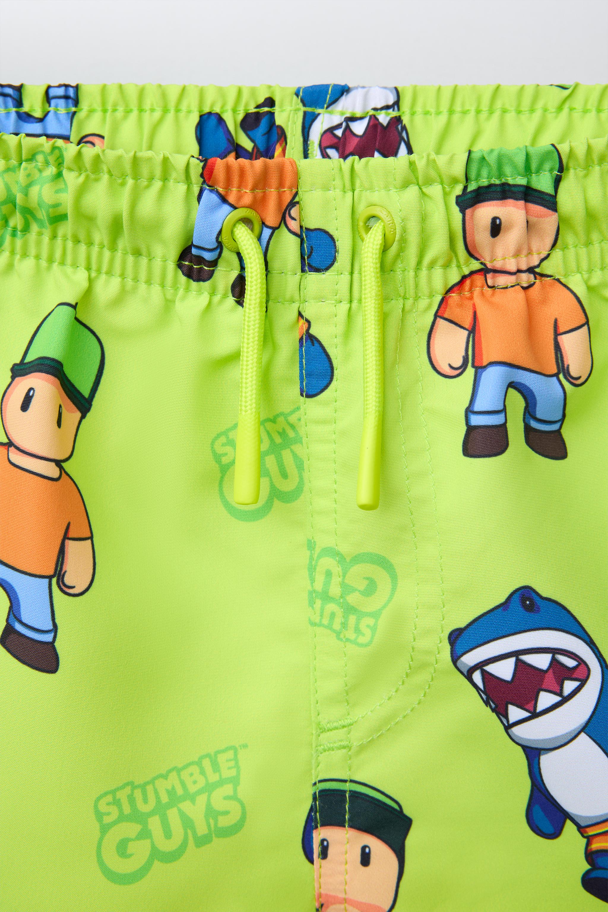 6-14 YEARS/ STUMBLE GUYS ™ © SCOPELY SWIM SHORTS