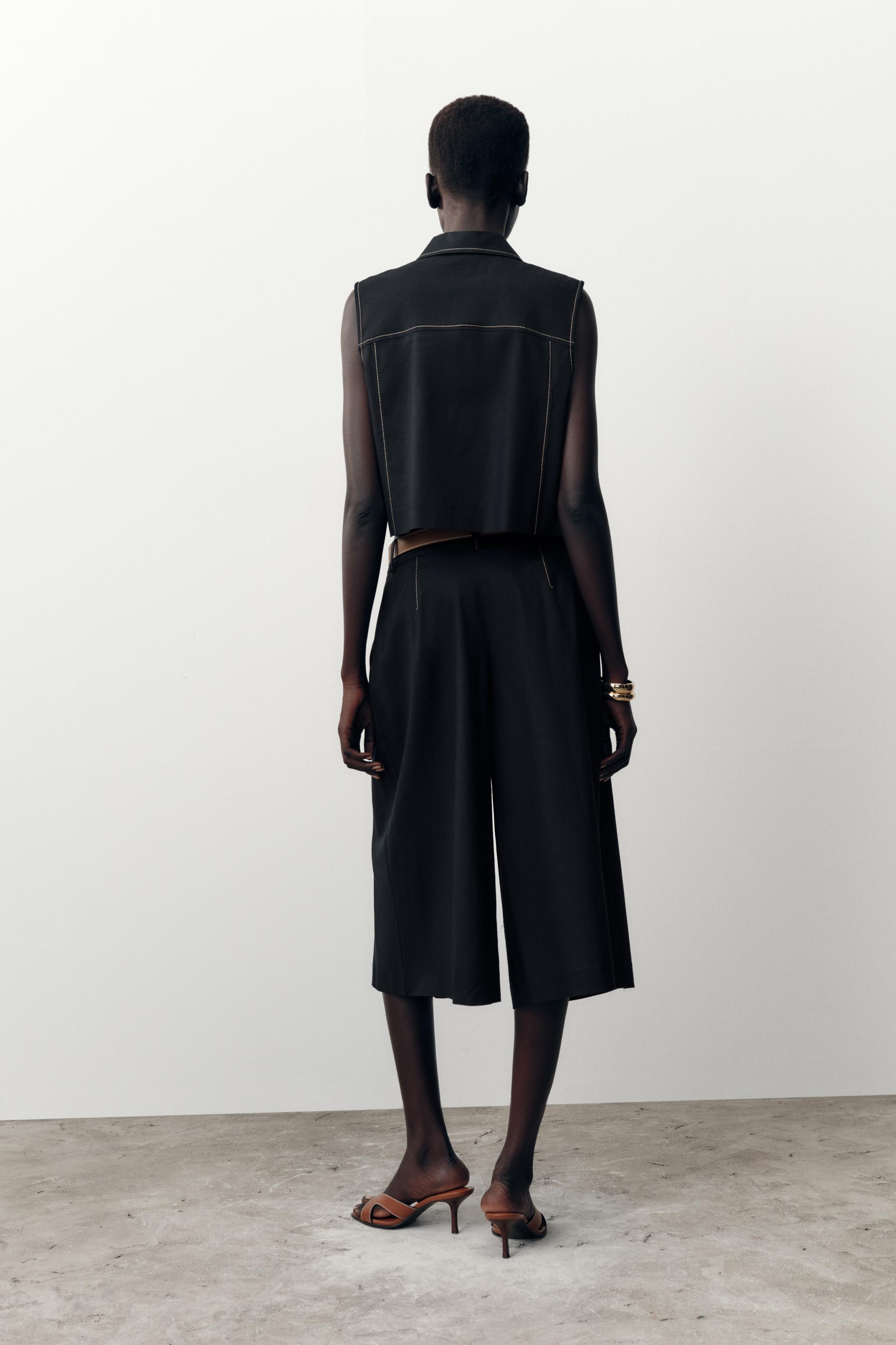 BELTED LONG PLEATED SHORTS