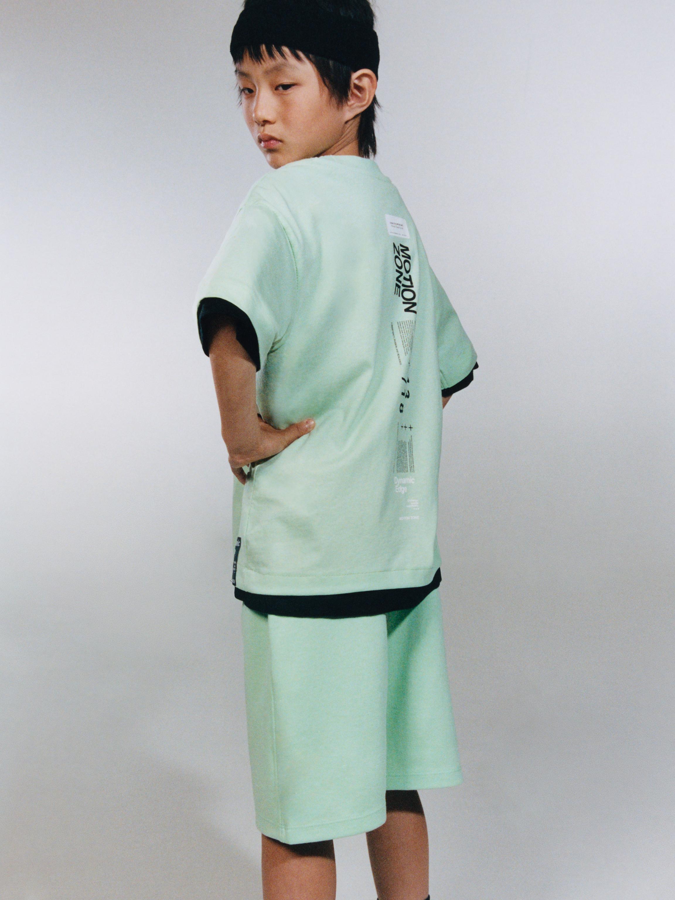 ATHLETIC SHORTS WITH RAISED TEXT