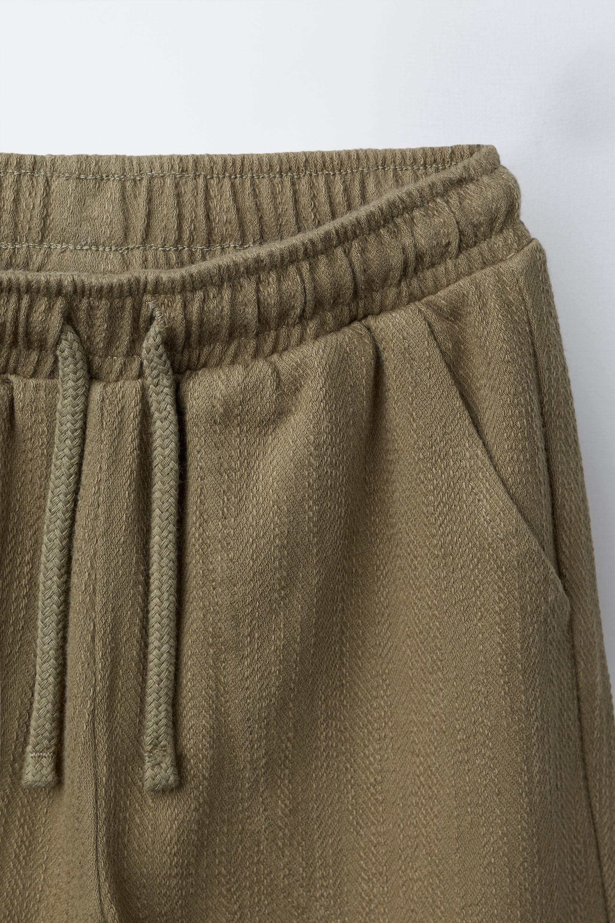 TEXTURED PANTS WITH LABEL