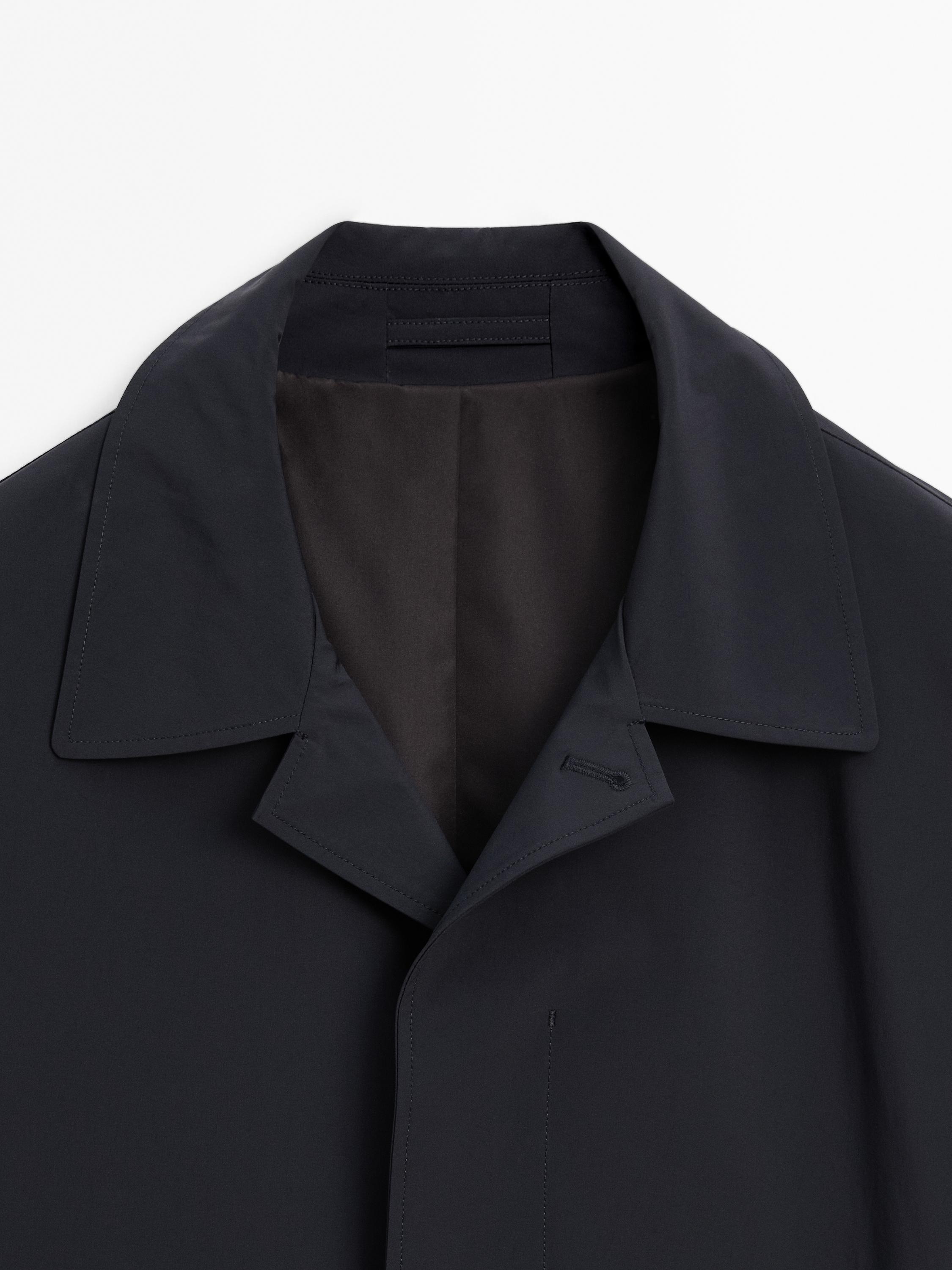 Lightweight trench coat with hidden buttons