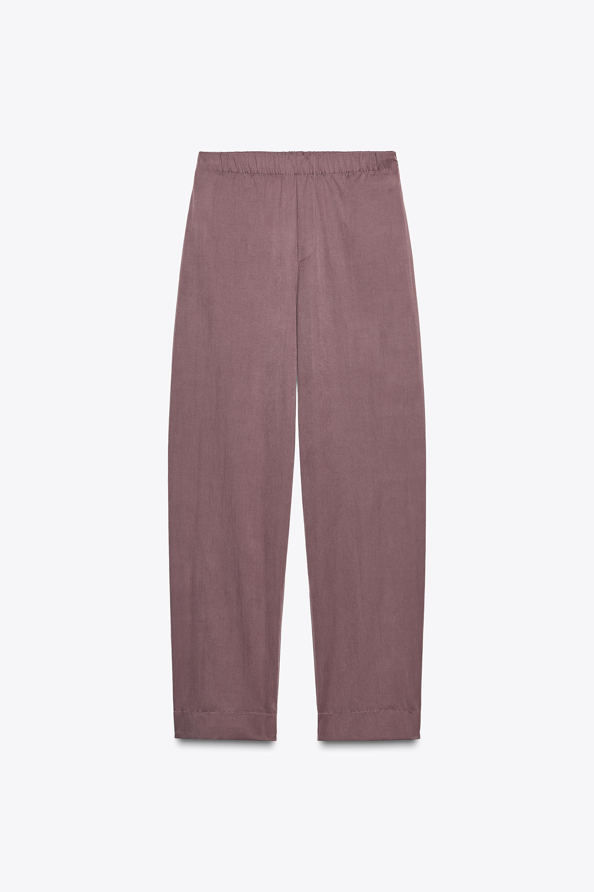 NYLON PANTS WITH BUTTON HEM