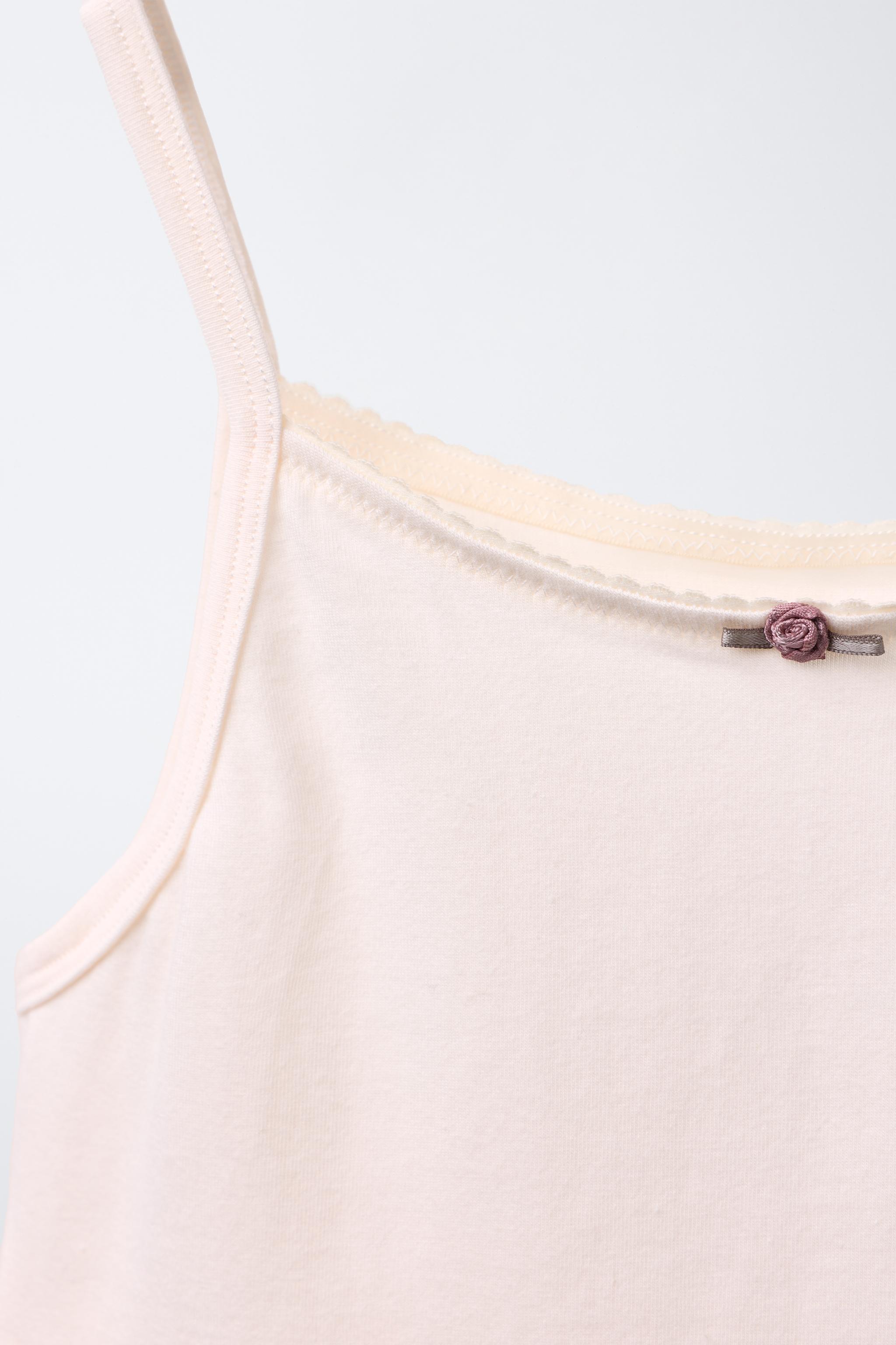 AGES 6-14/ TWO-PACK OF TANK TOPS WITH FLOWER DETAIL