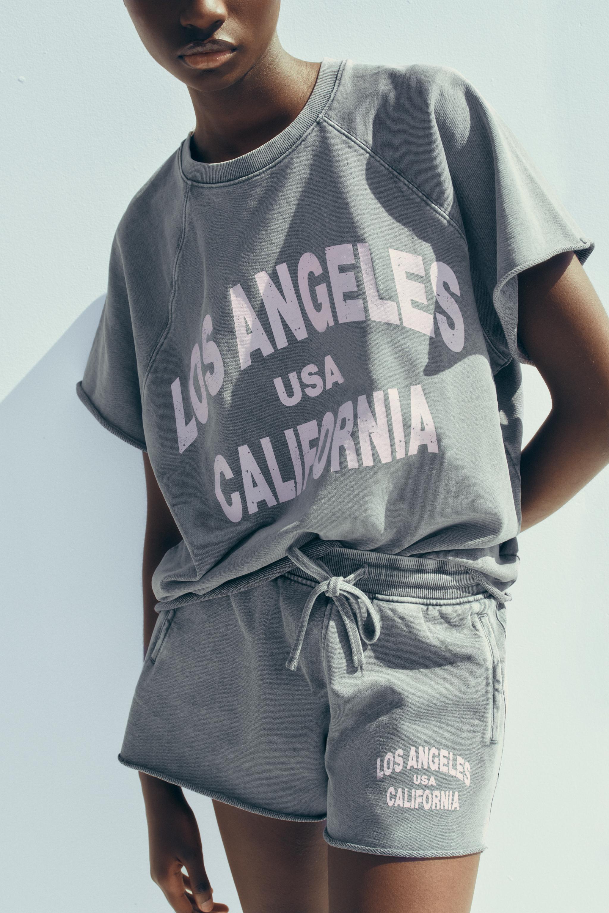 WASHED EFFECT TEXT PLUSH SWEATSHIRT