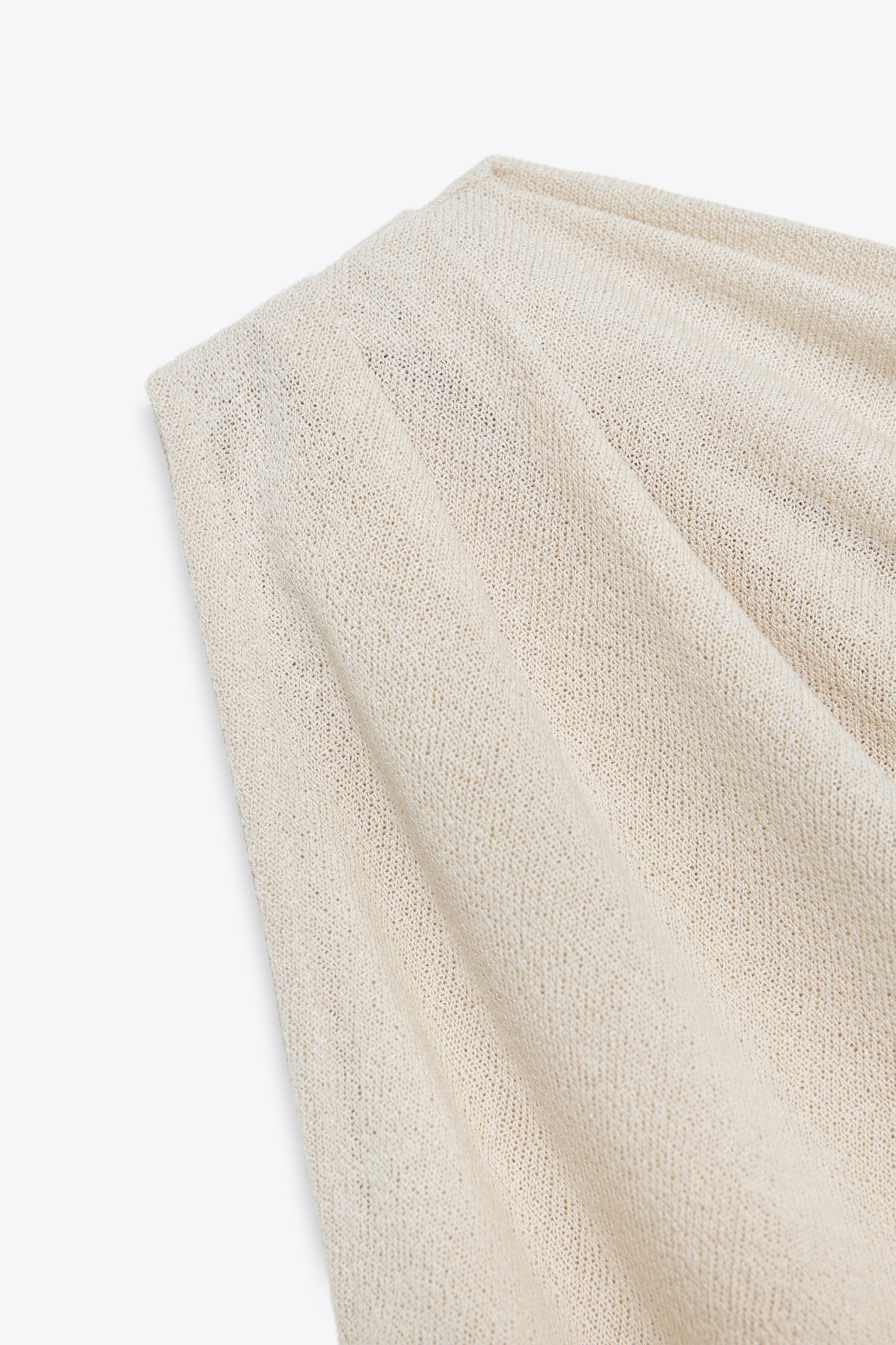 ASYMMETRIC CUT-OUT KNIT TOP