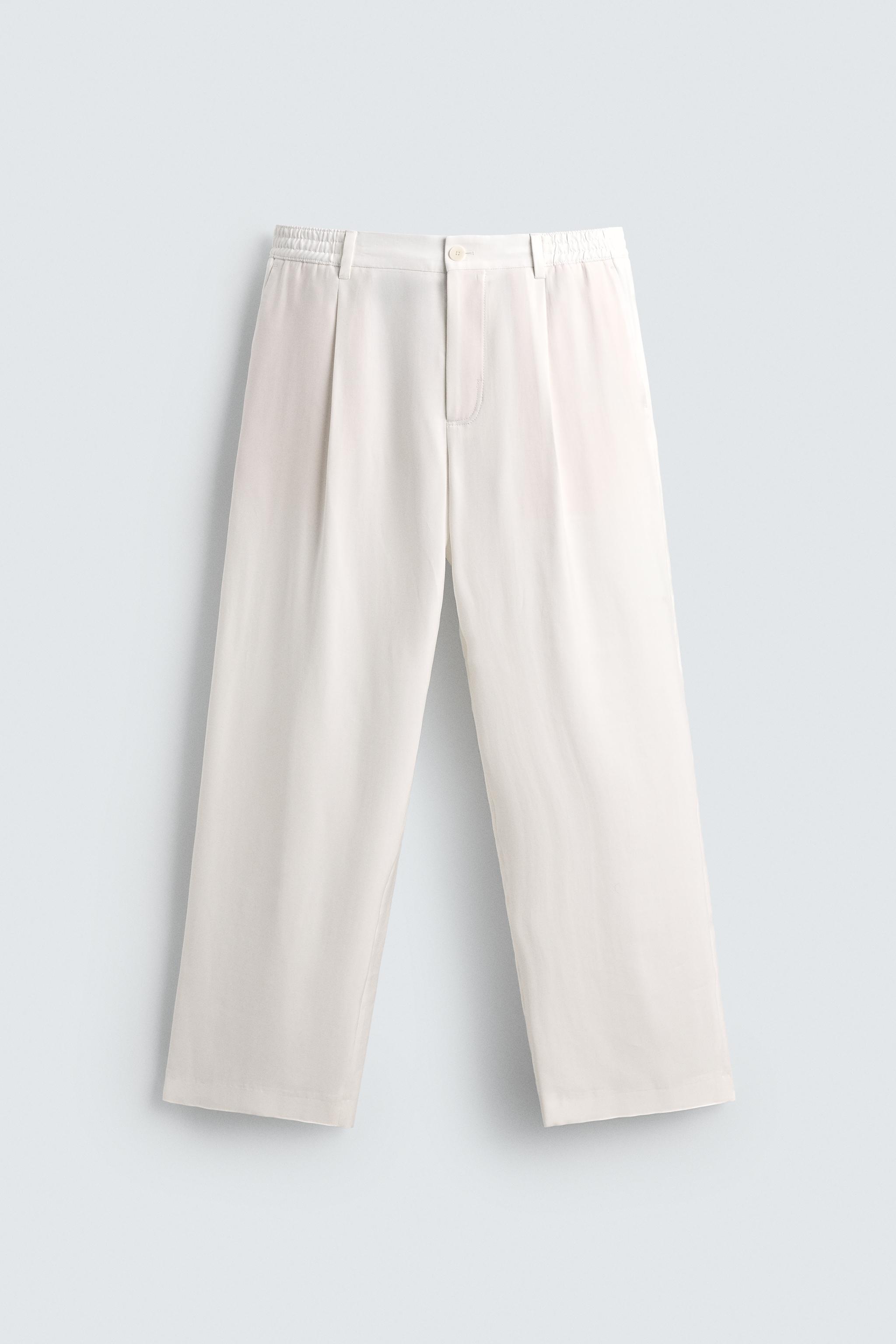 RELAXED FIT PLEATED PANTS