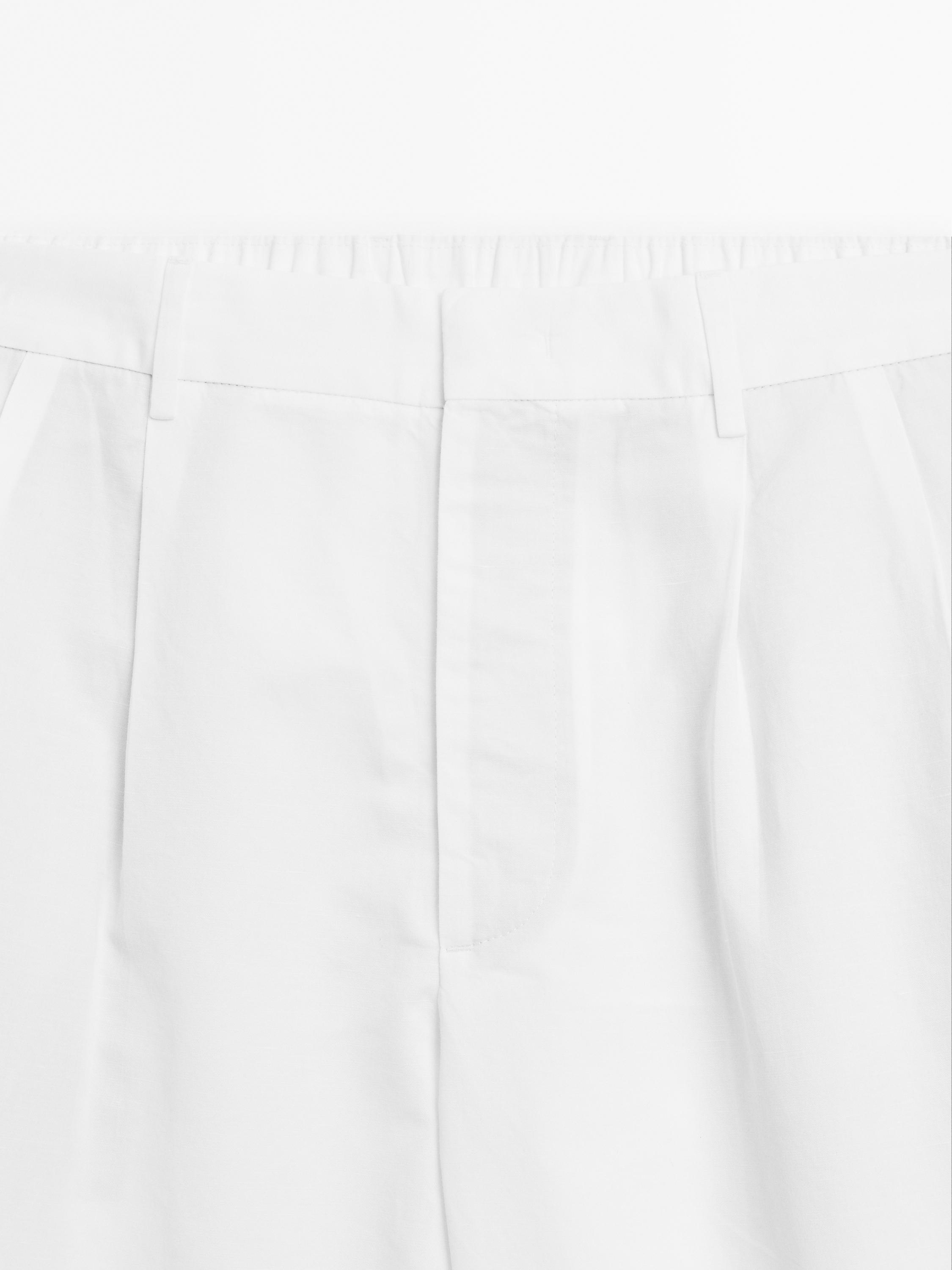 Balloon fit trousers with double darts