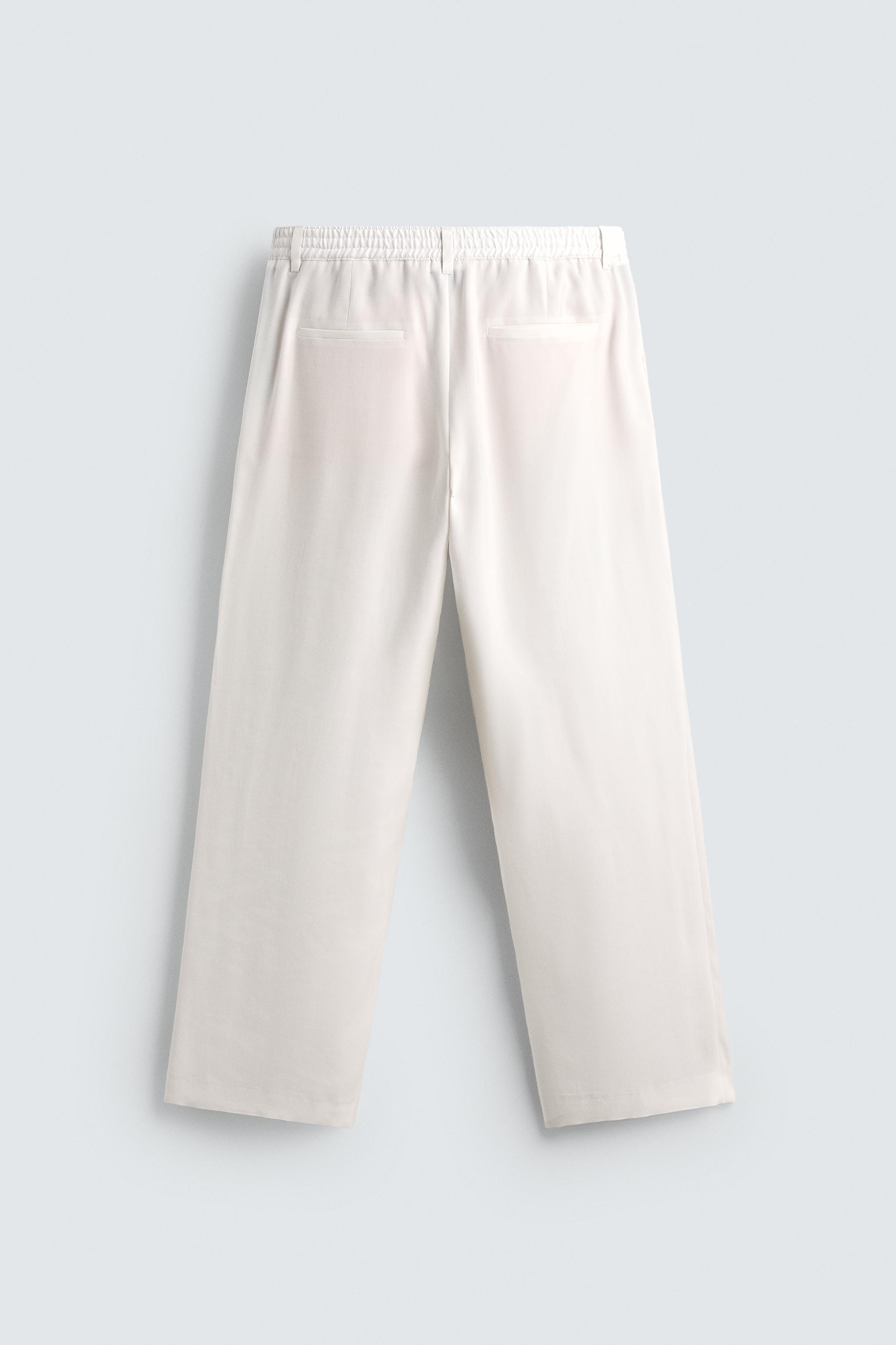 RELAXED FIT PLEATED PANTS