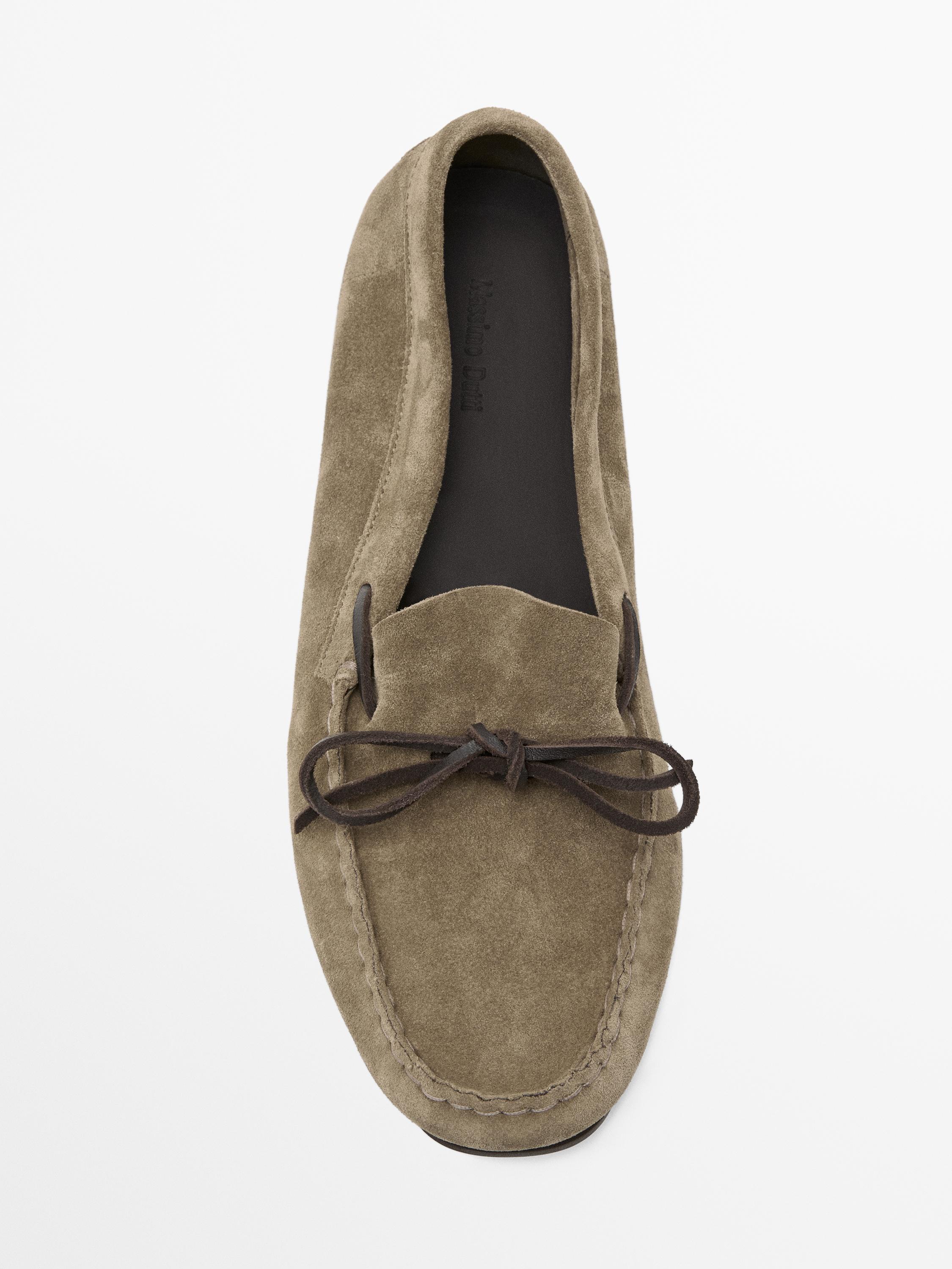 Split suede loafers with bow