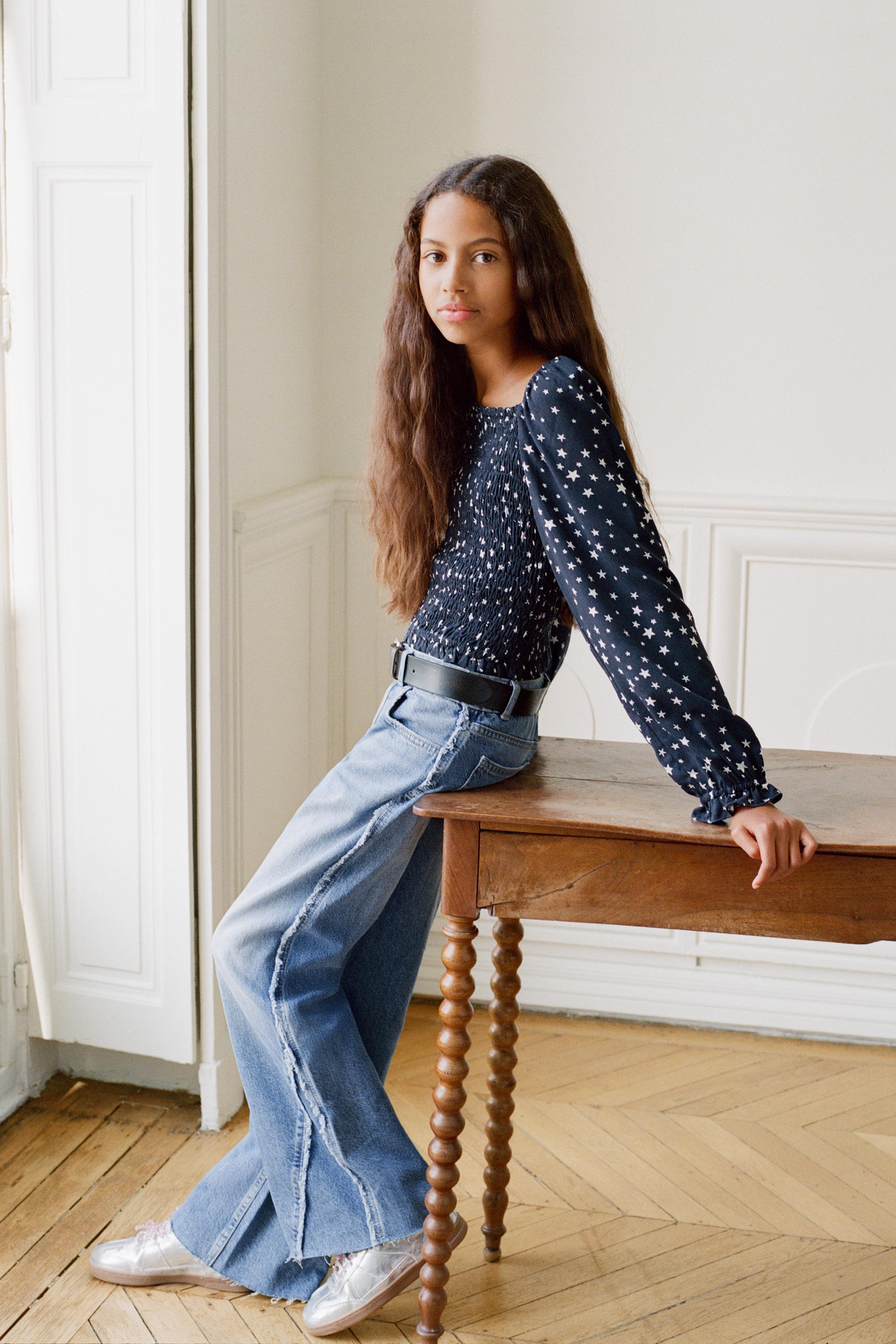 FRAYED BOOTCUT JEANS