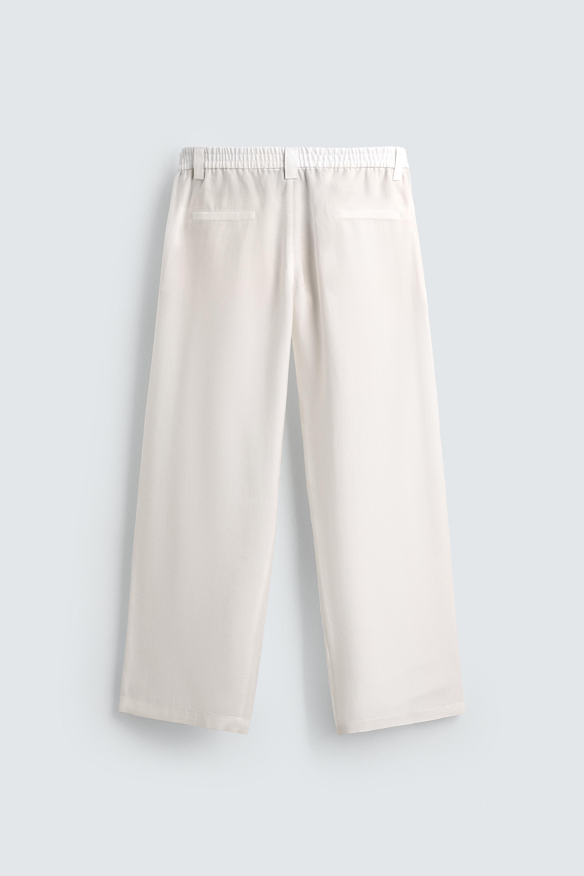 FLOWY PANTS WITH SIDE PLEATS