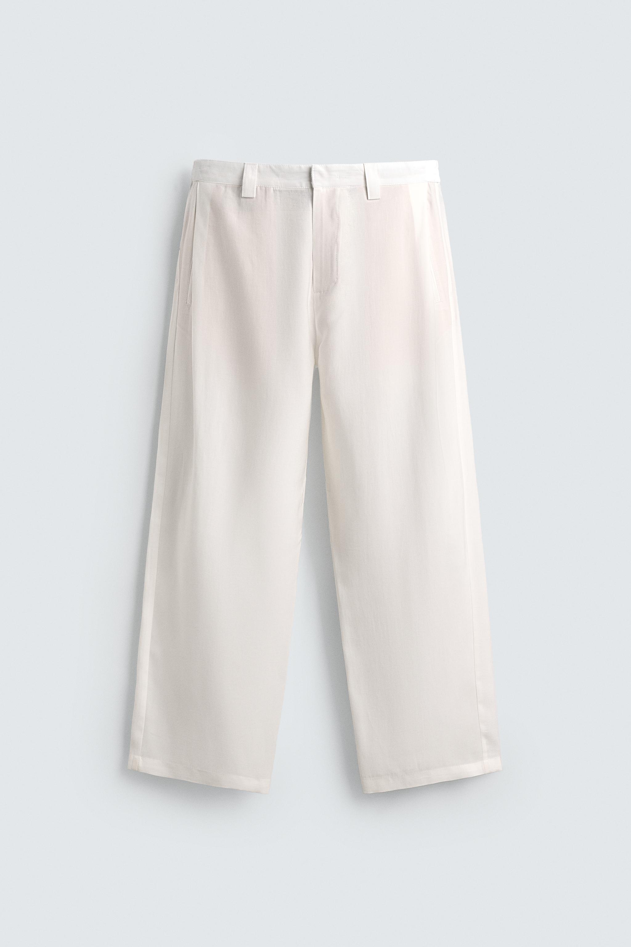 FLOWY PANTS WITH SIDE PLEATS