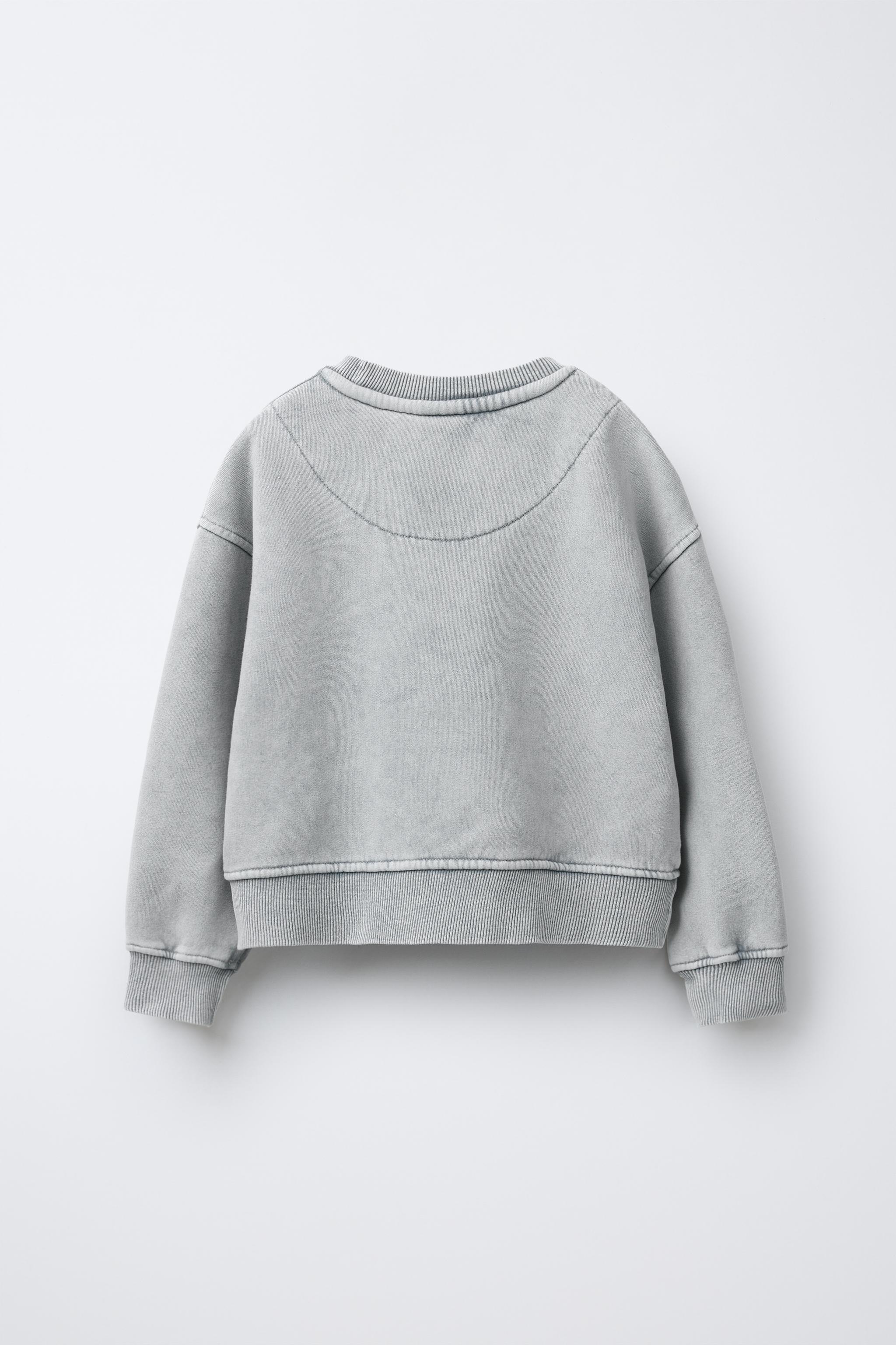 WASHED EFFECT GLITTER STAR SWEATSHIRT