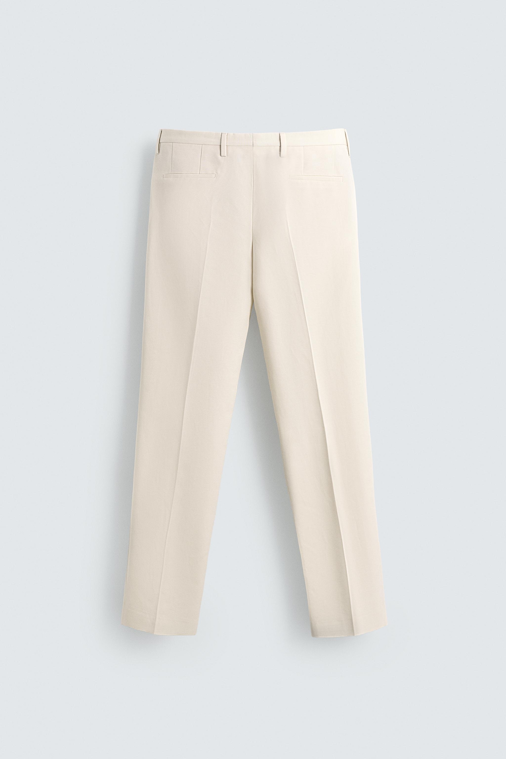REGULAR FIT PLEATED PANTS