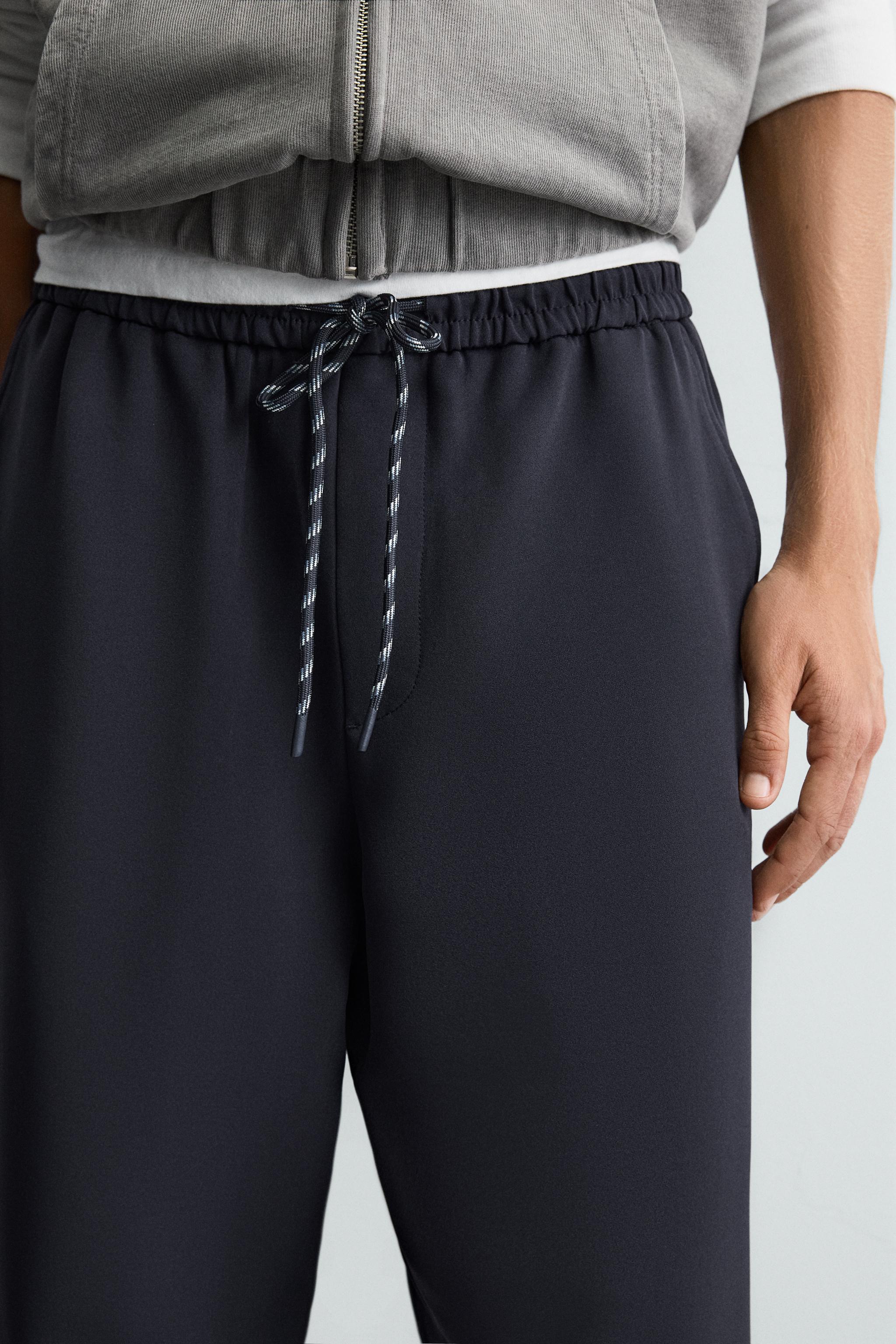WIDE FIT JOGGER PANTS WITH SIDE STRIPES