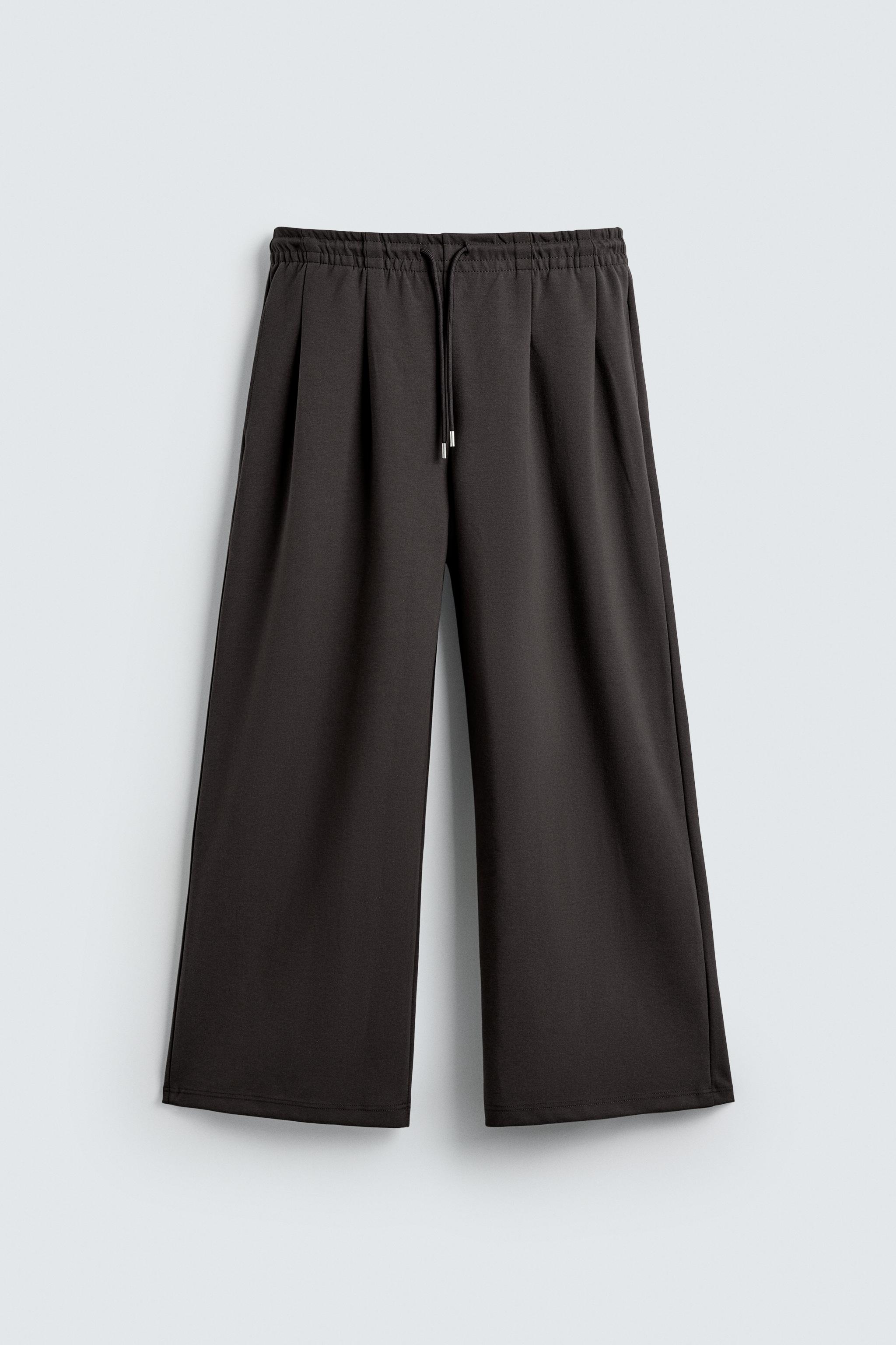 INTERLOCK PLEATED LABEL PANTS