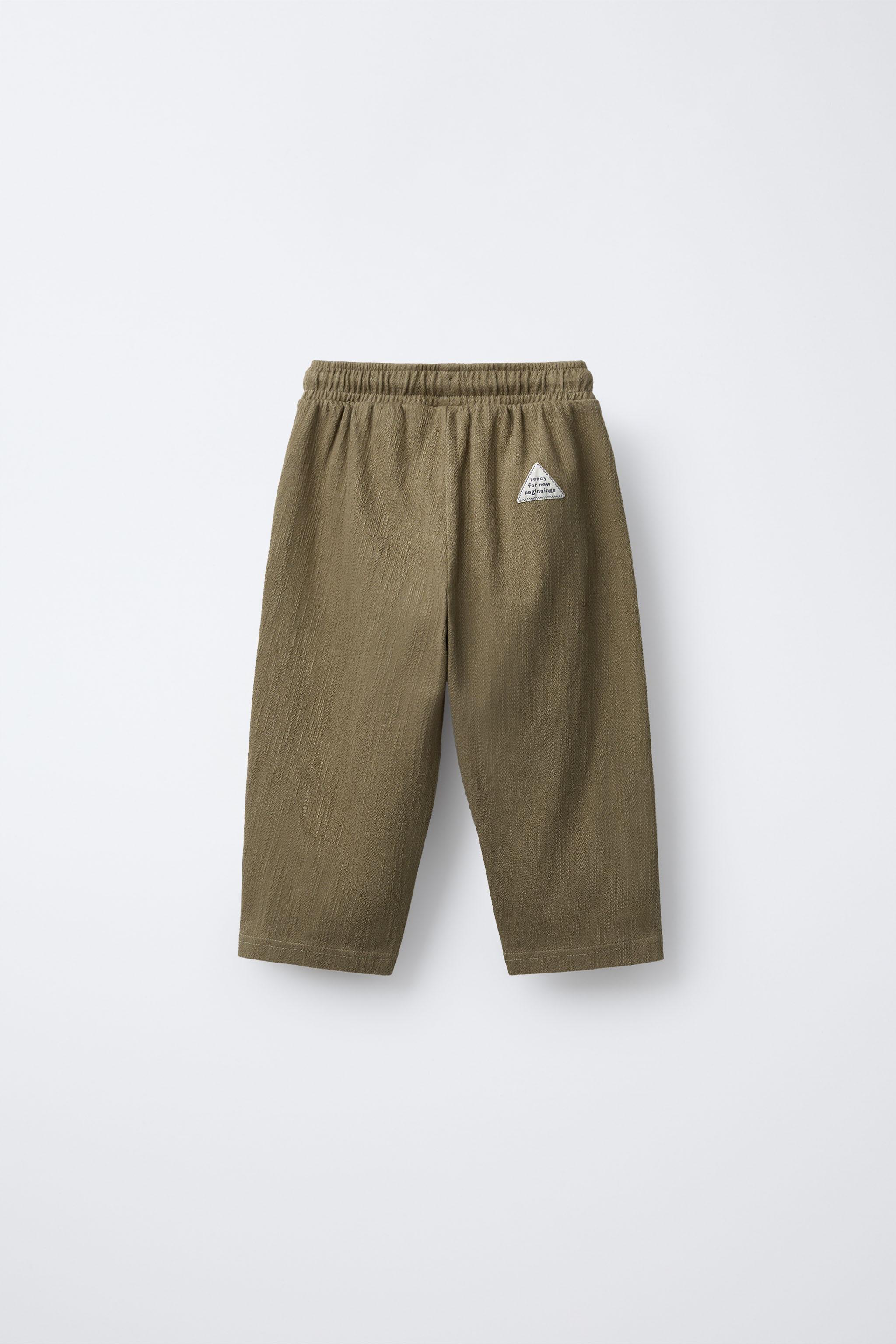 TEXTURED PANTS WITH LABEL