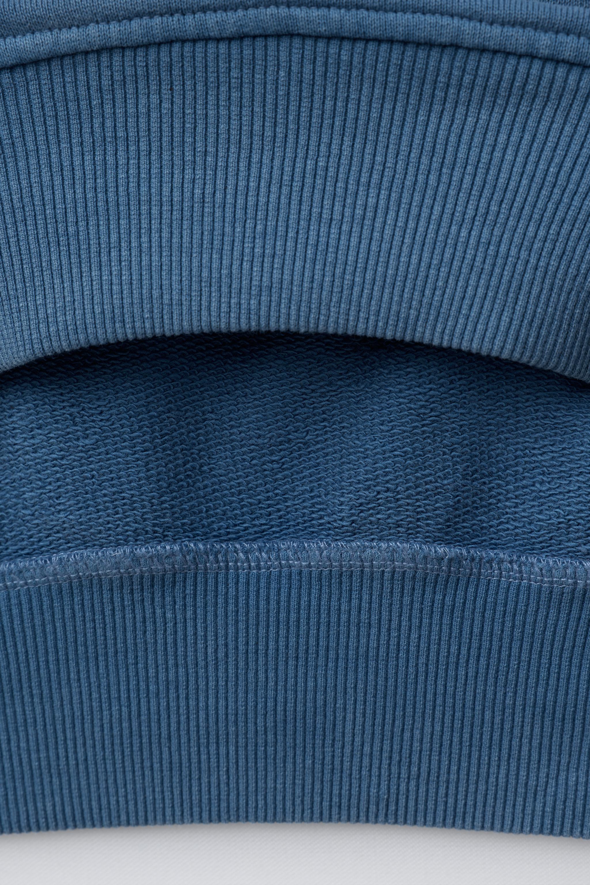 WASHED EFFECT STUDDED STAR SWEATSHIRT