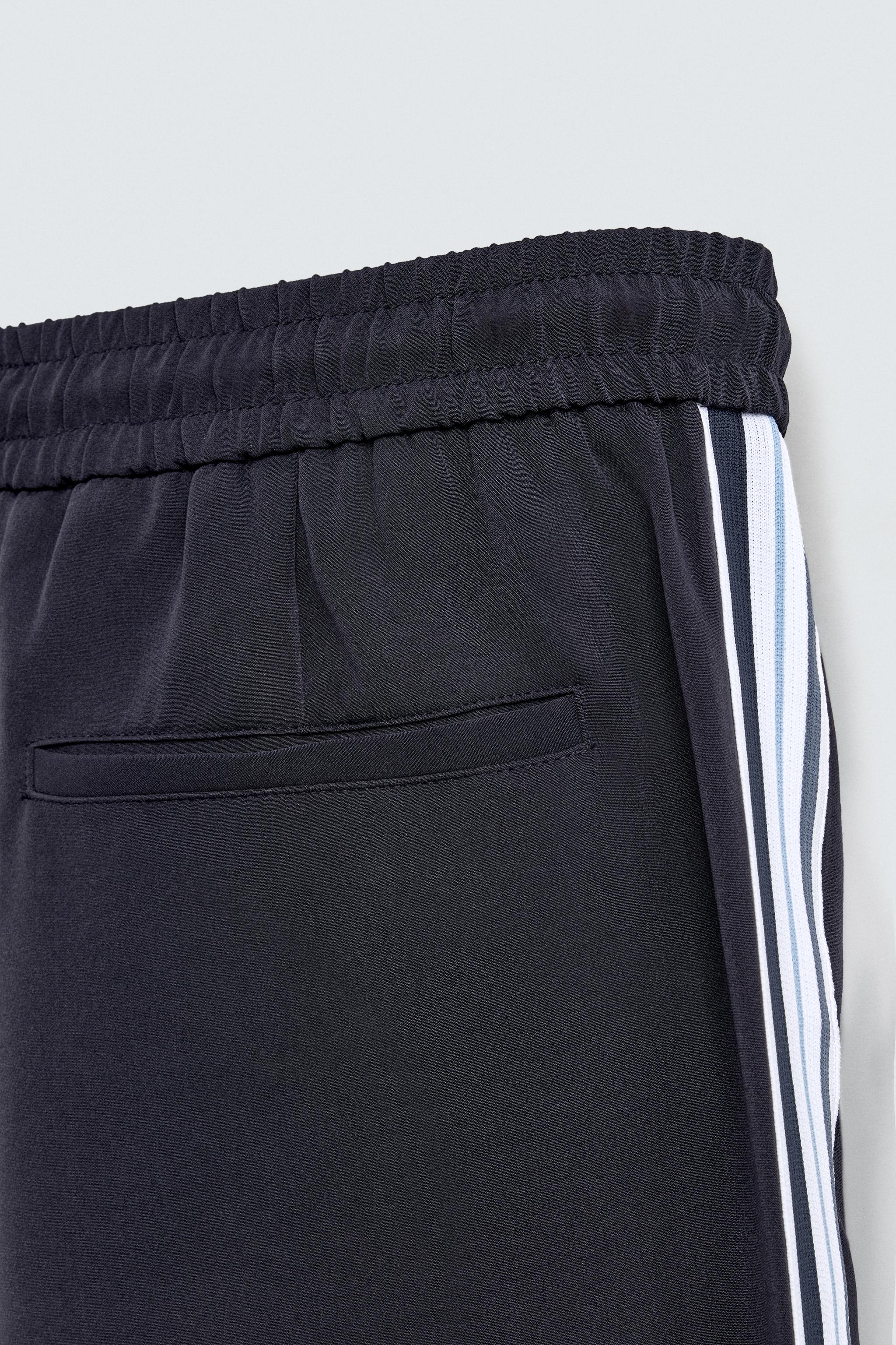 WIDE FIT JOGGER PANTS WITH SIDE STRIPES