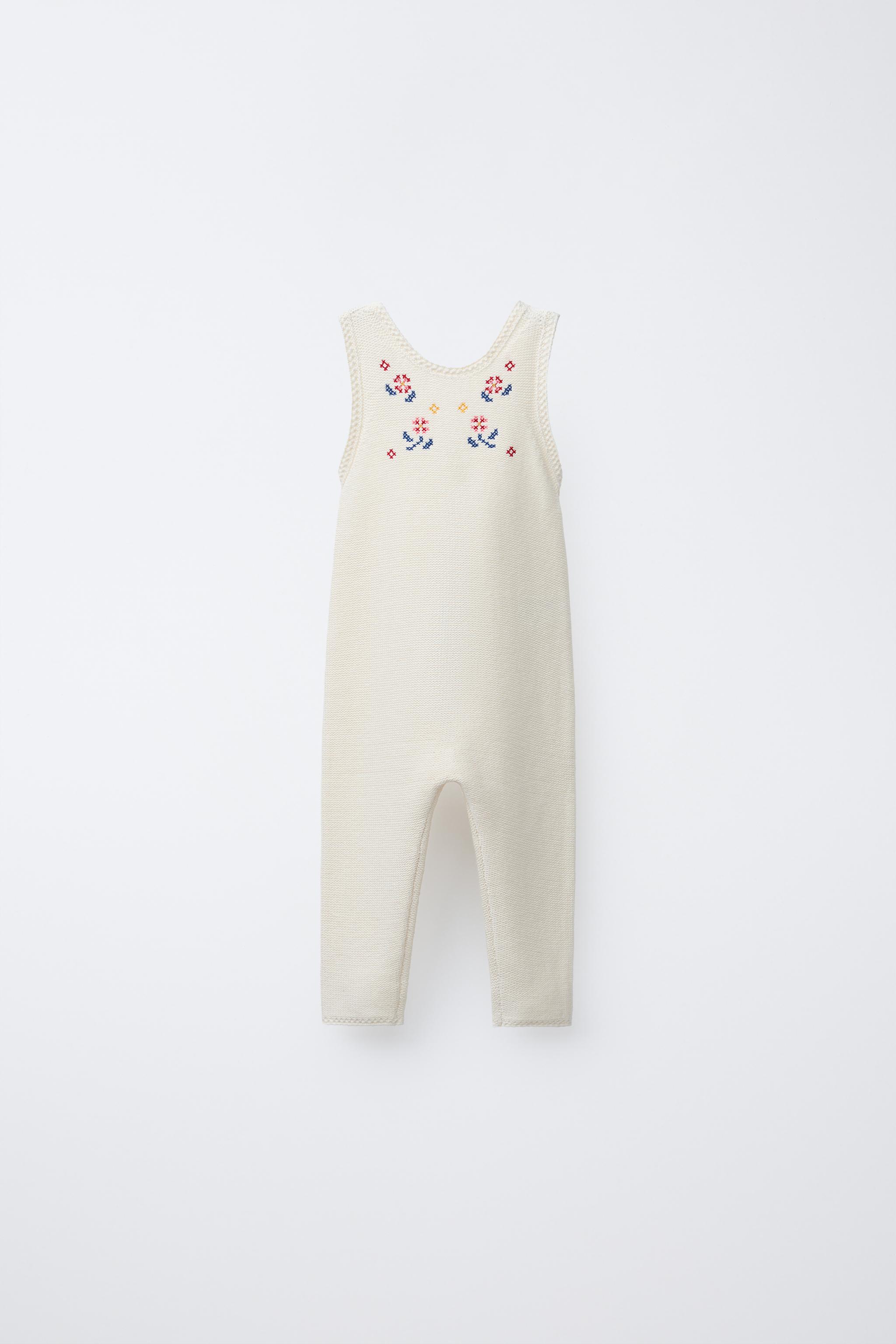 LONG KNIT OVERALLS WITH CROSS-STITCH DETAILS