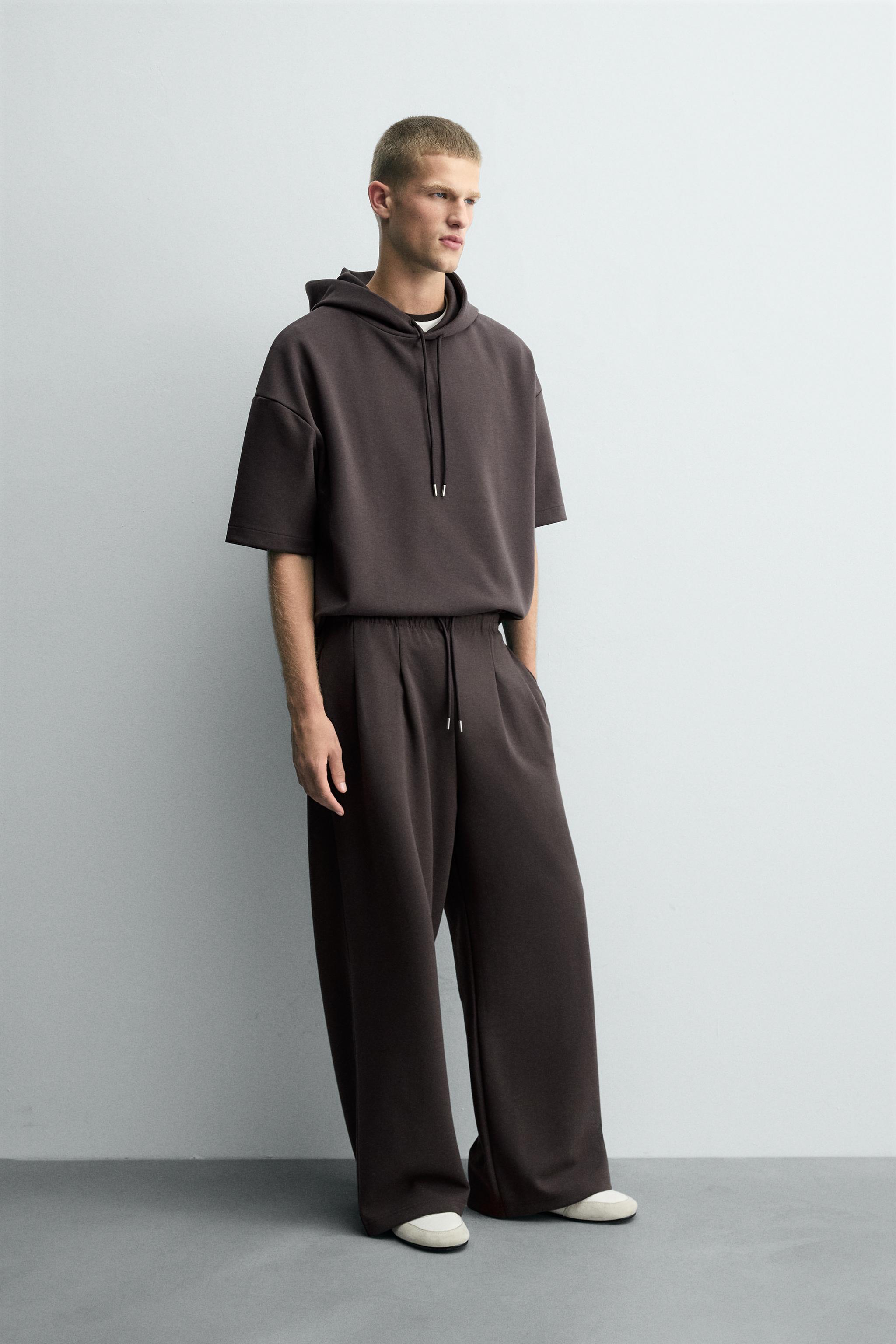 INTERLOCK PLEATED LABEL PANTS