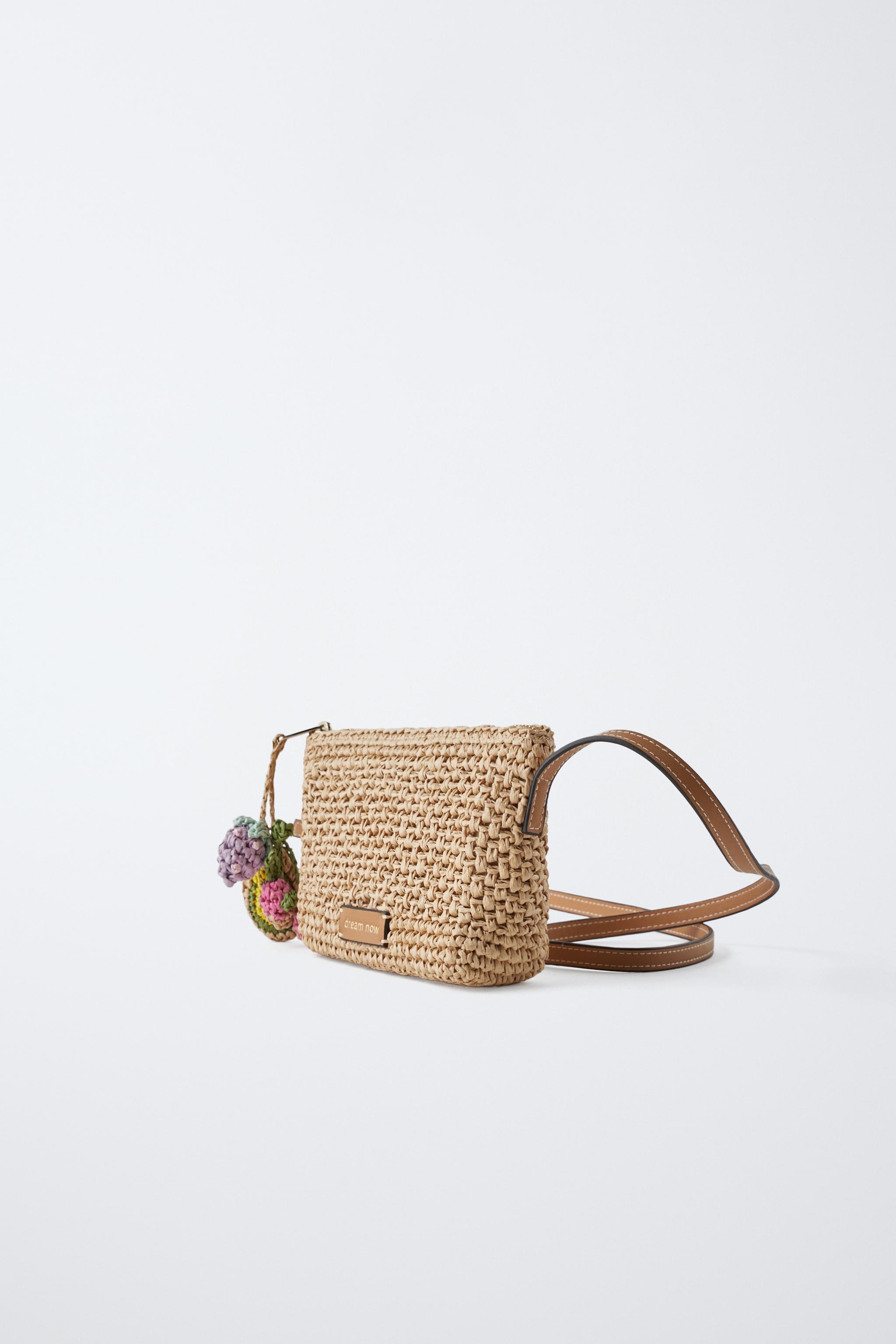 RAFFIA EFFECT CHARM CROSSBODY BAG