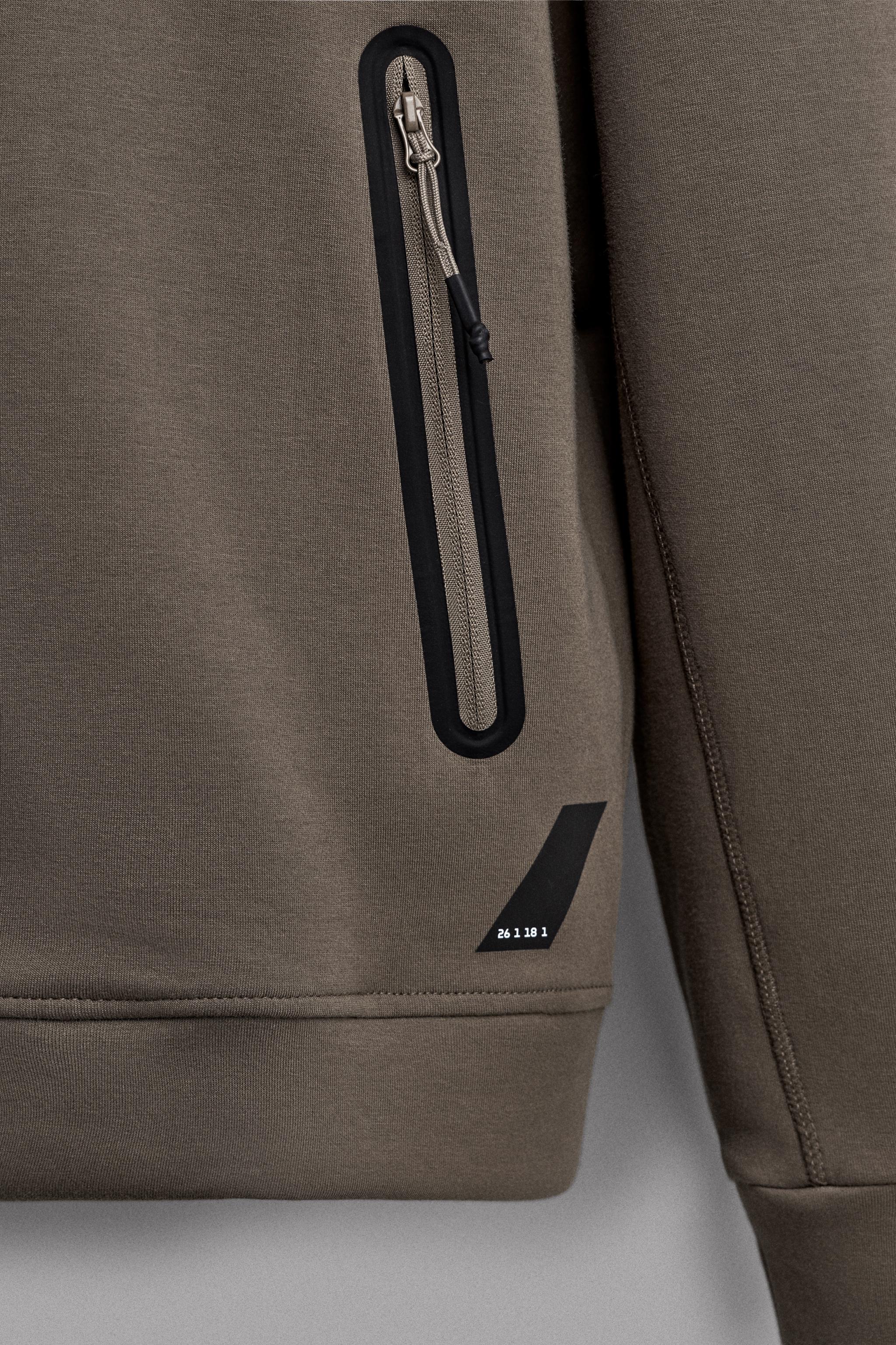 TECHNICAL ZIP-UP HOODIE