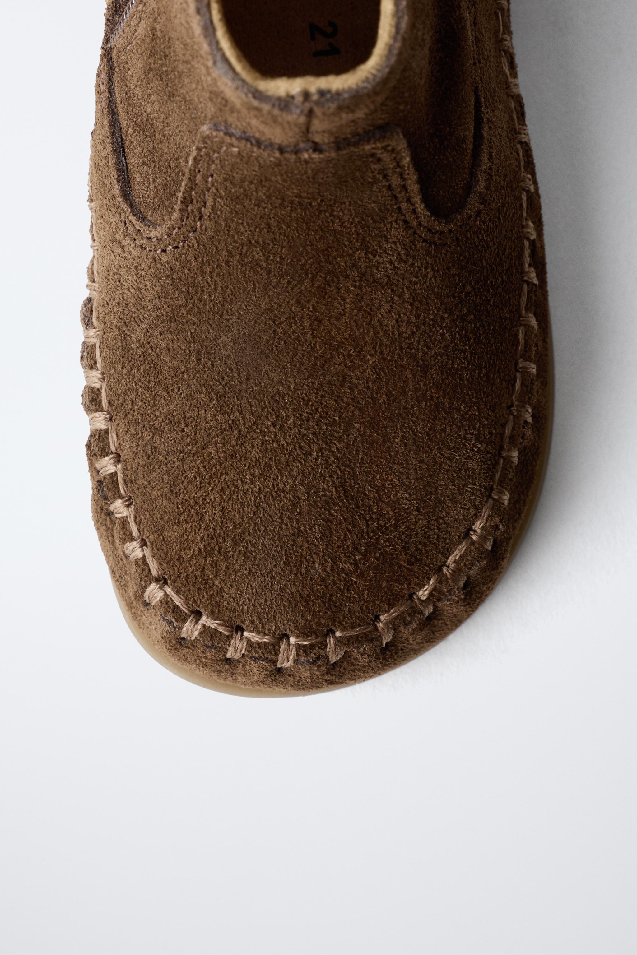 FRINGED LEATHER BOOTS