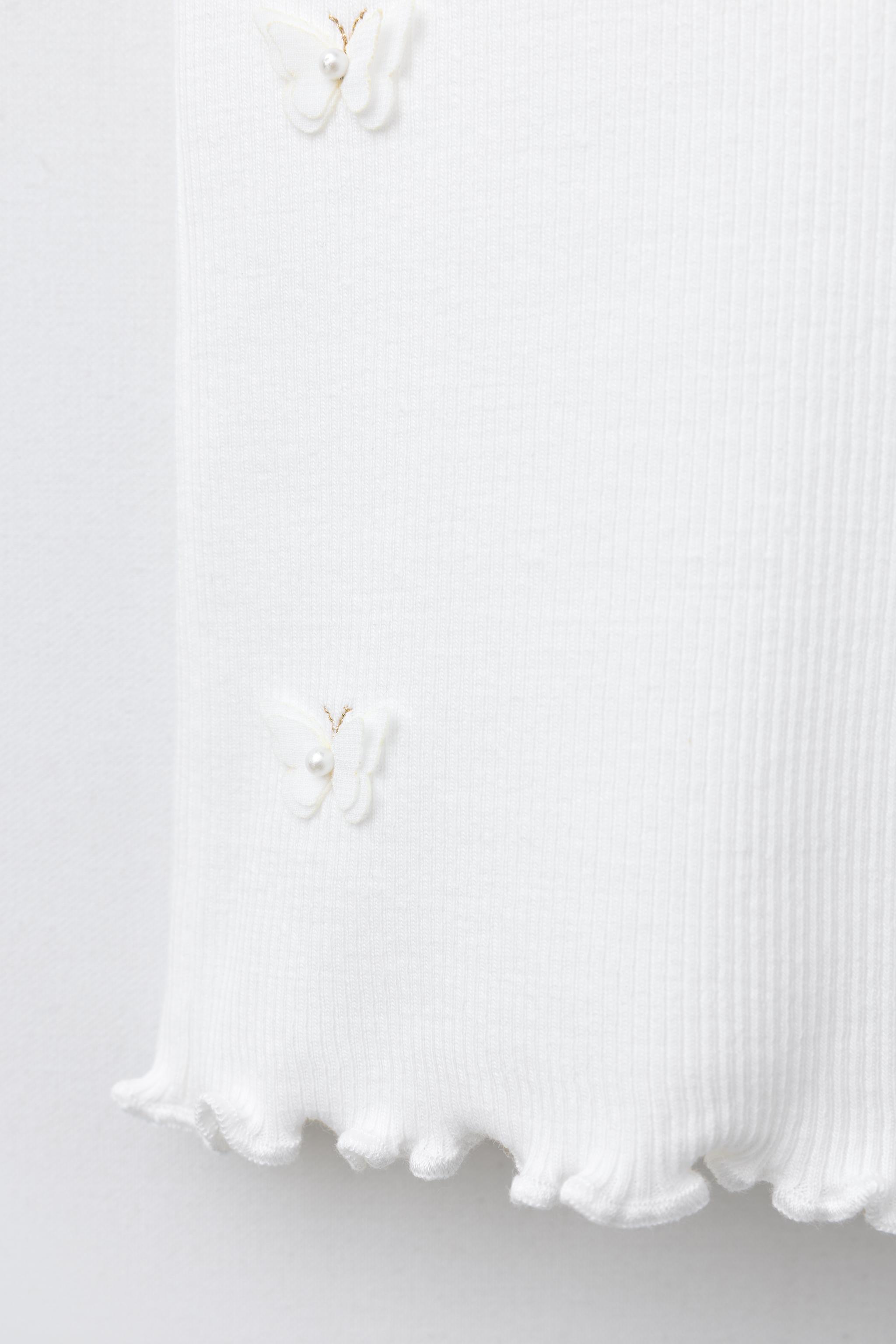 BUTTERFLY AND FLOWER RIBBED TOP