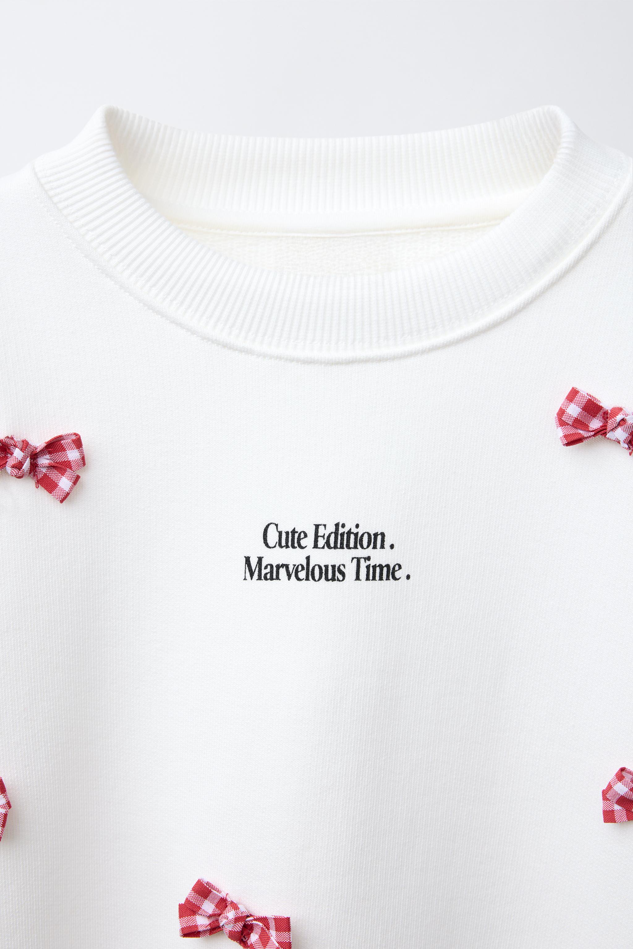 TEXT AND BOWS SWEATSHIRT