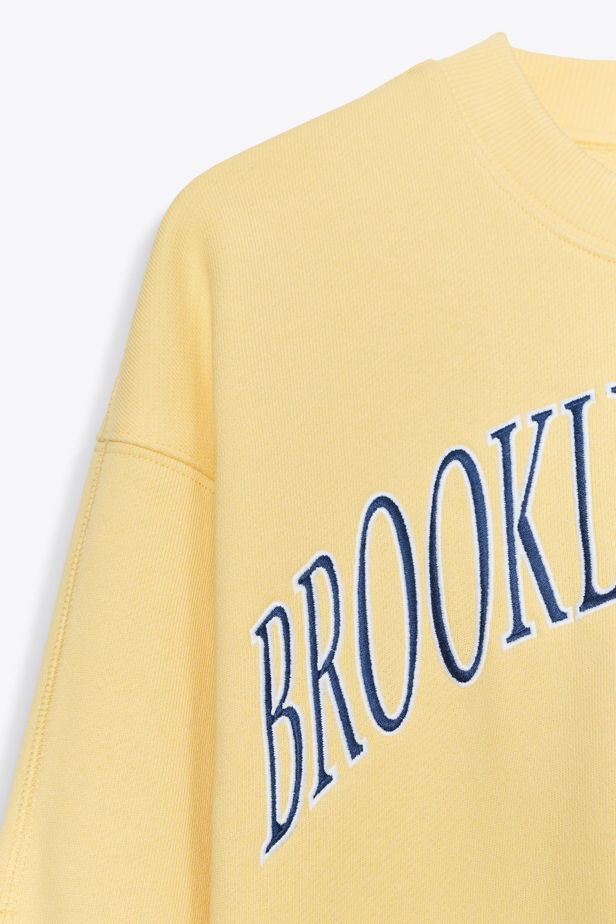 EMBROIDERED TEXT PLUSH SWEATSHIRT