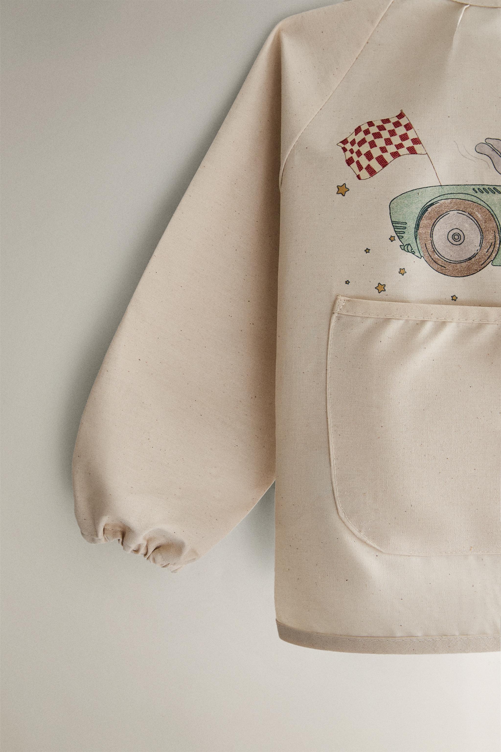 BABY BIB WITH SLEEVES AND RACING DOG