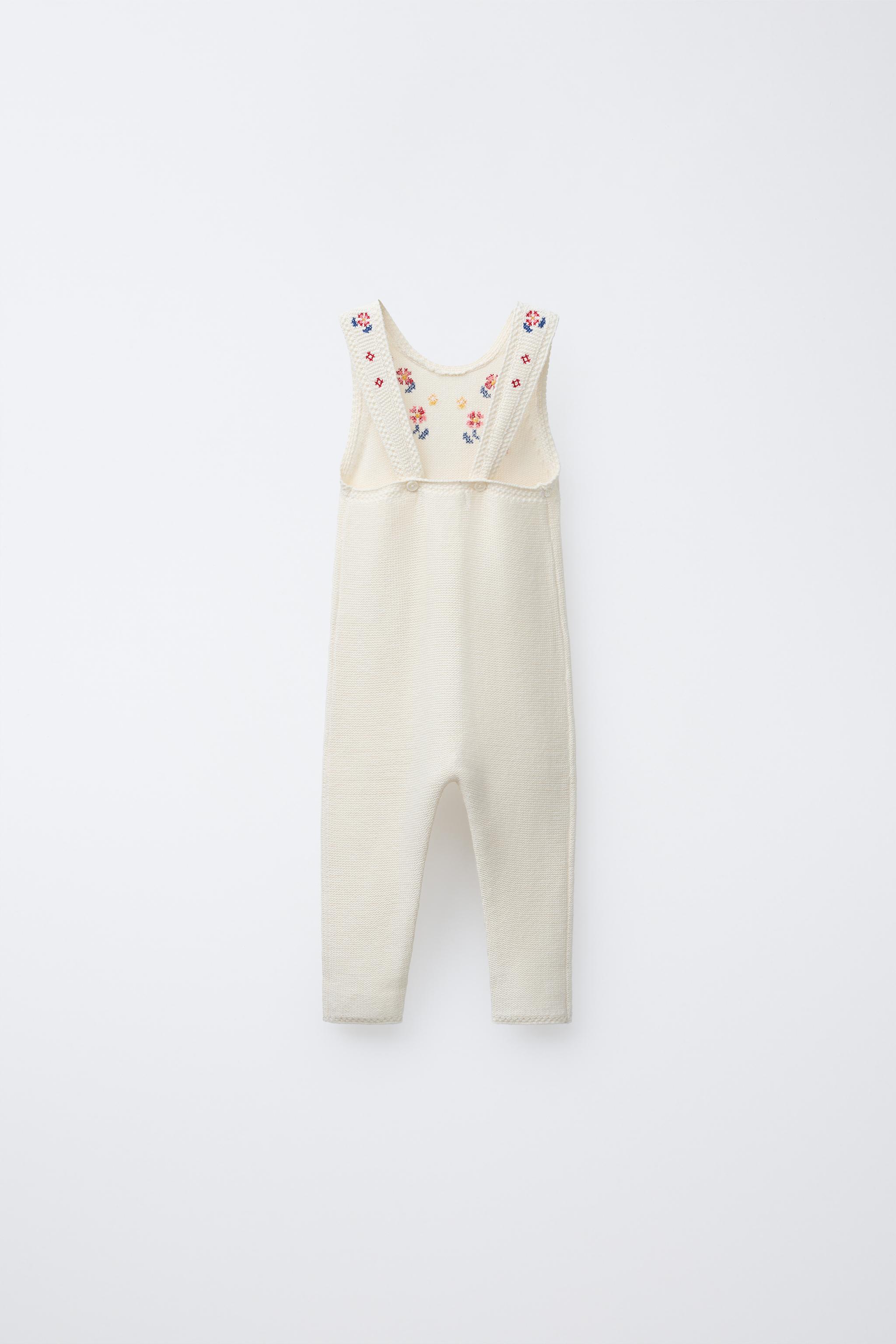 LONG KNIT OVERALLS WITH CROSS-STITCH DETAILS