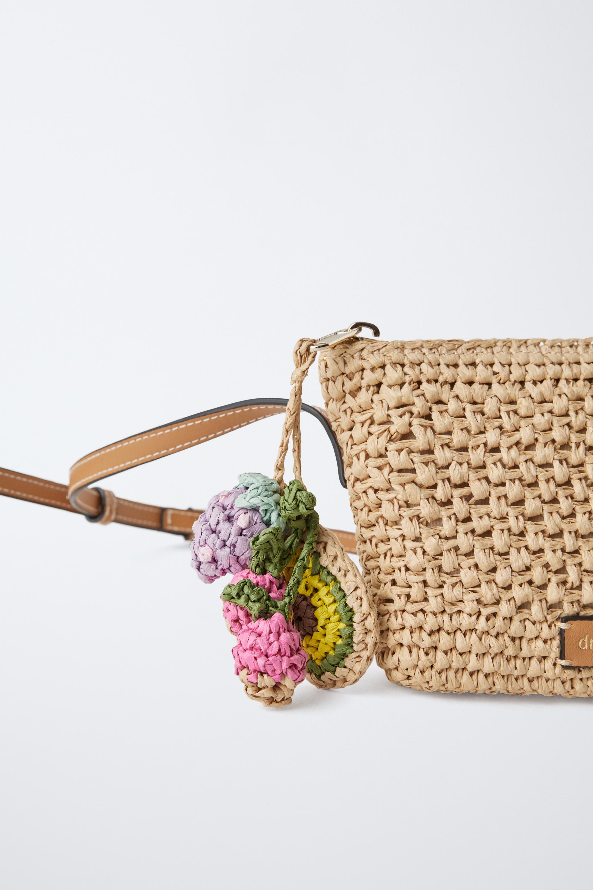 RAFFIA EFFECT CHARM CROSSBODY BAG