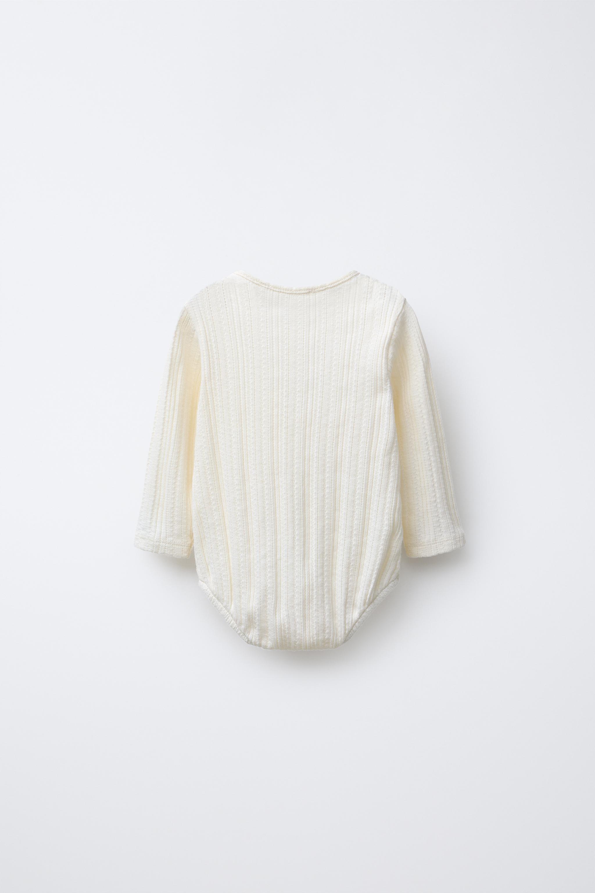 PRINTED POINTELLE BODYSUIT