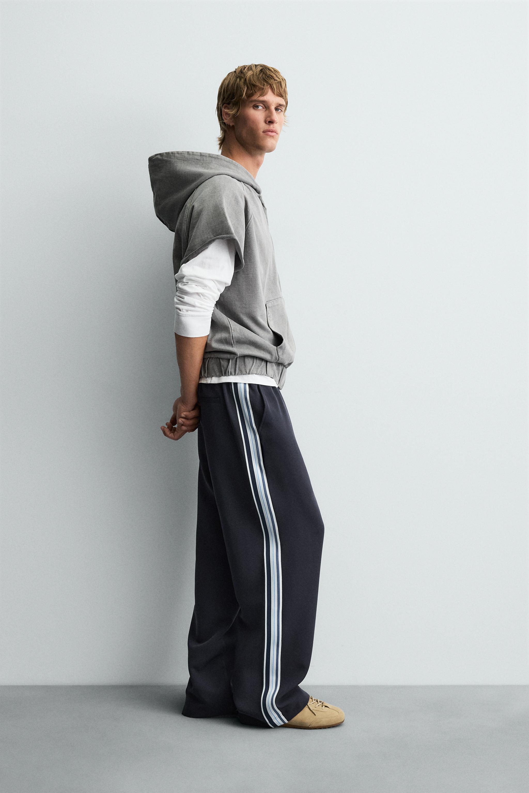 WIDE FIT JOGGER PANTS WITH SIDE STRIPES