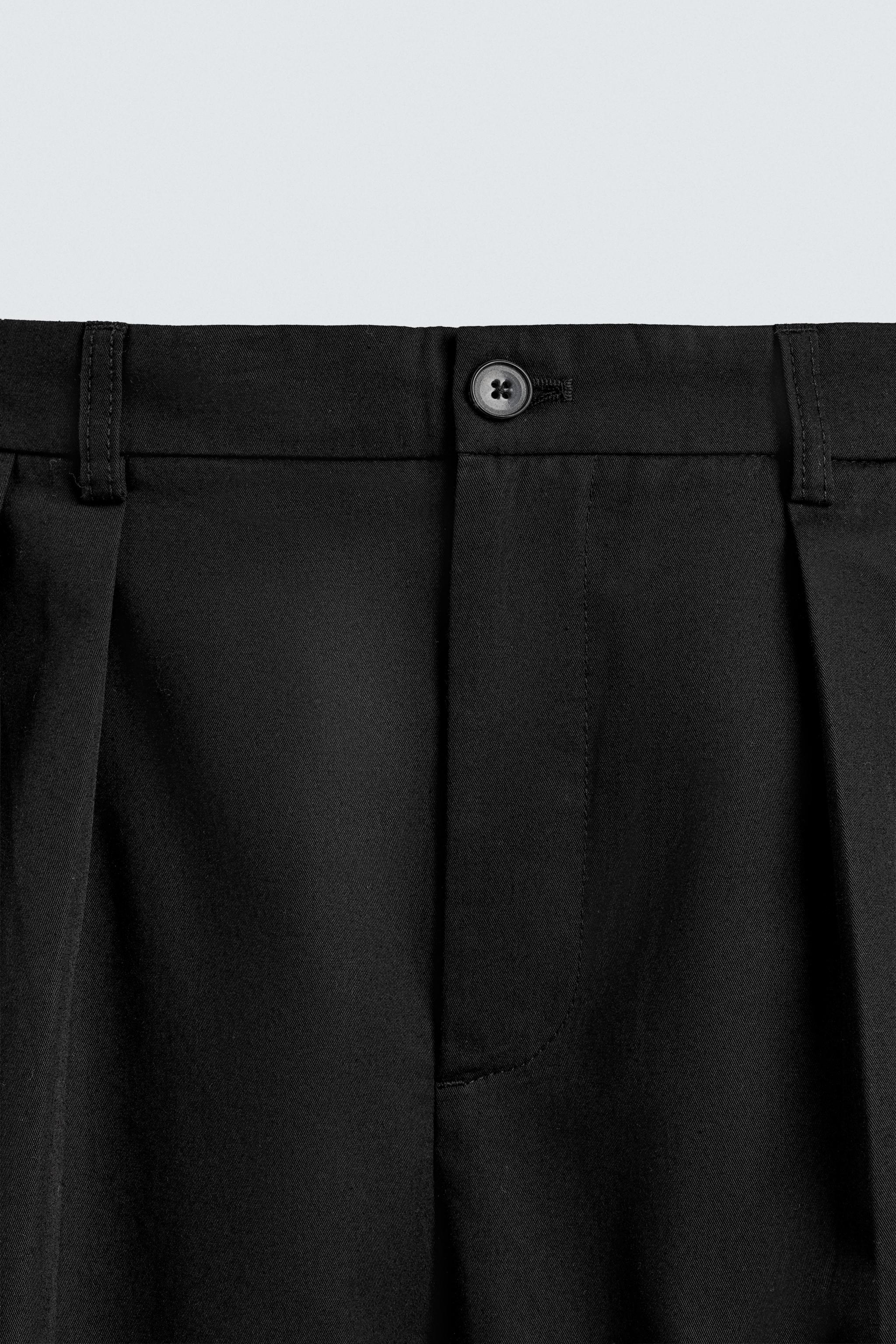 PLEATED WIDE FIT PANTS