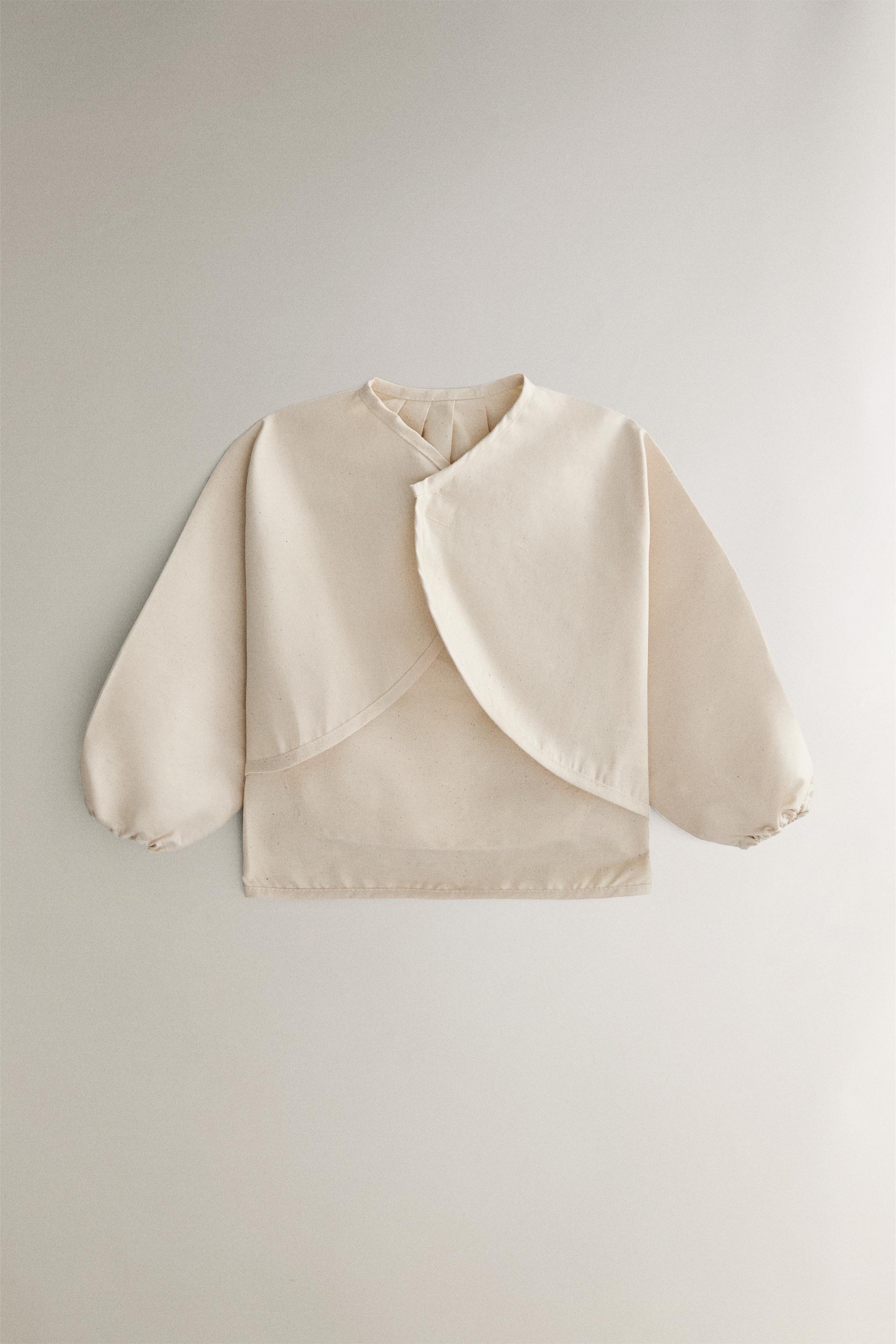 BABY BIB WITH SLEEVES AND RACING DOG