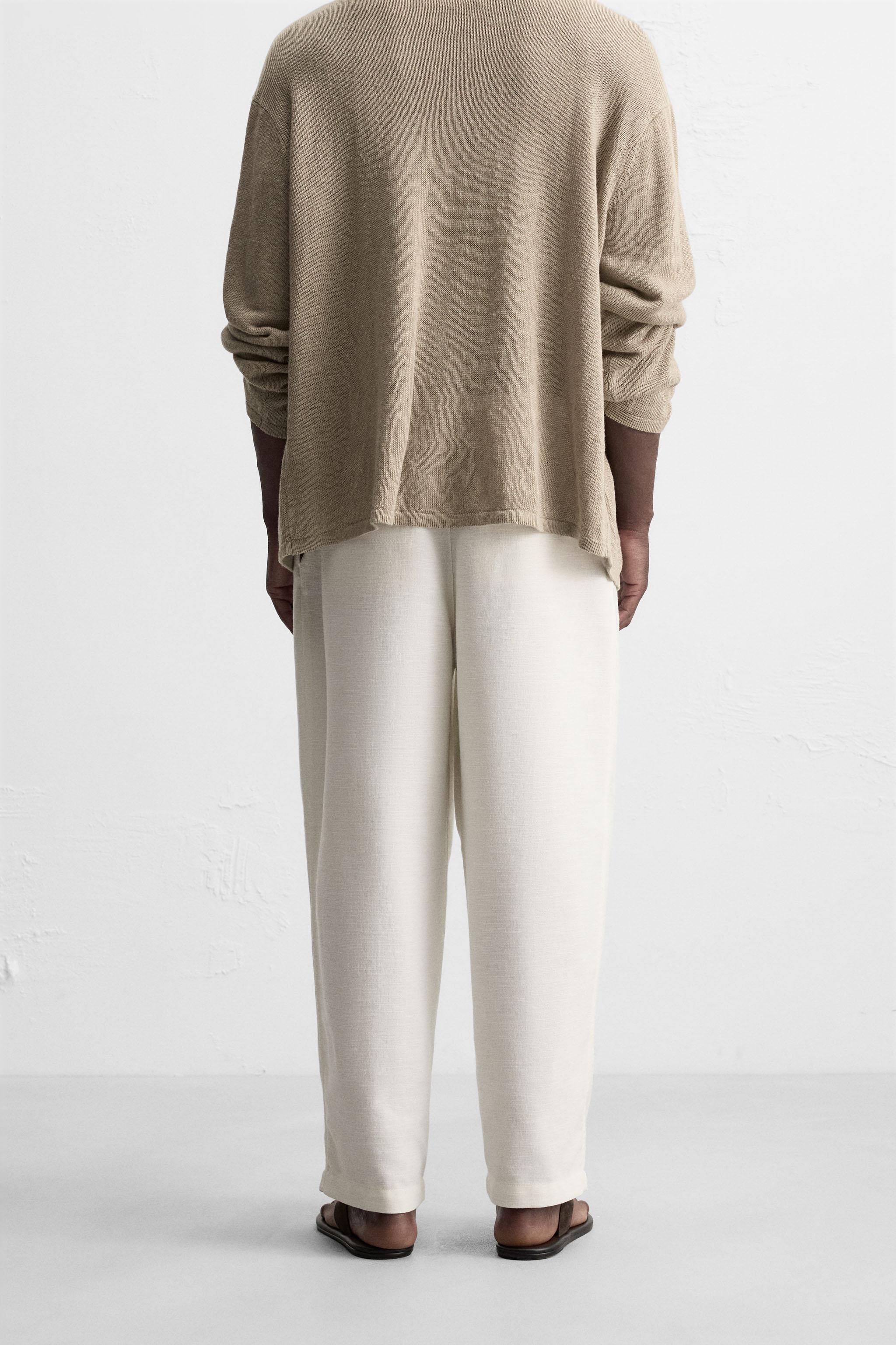 PLEATED RELAXED FIT PANTS