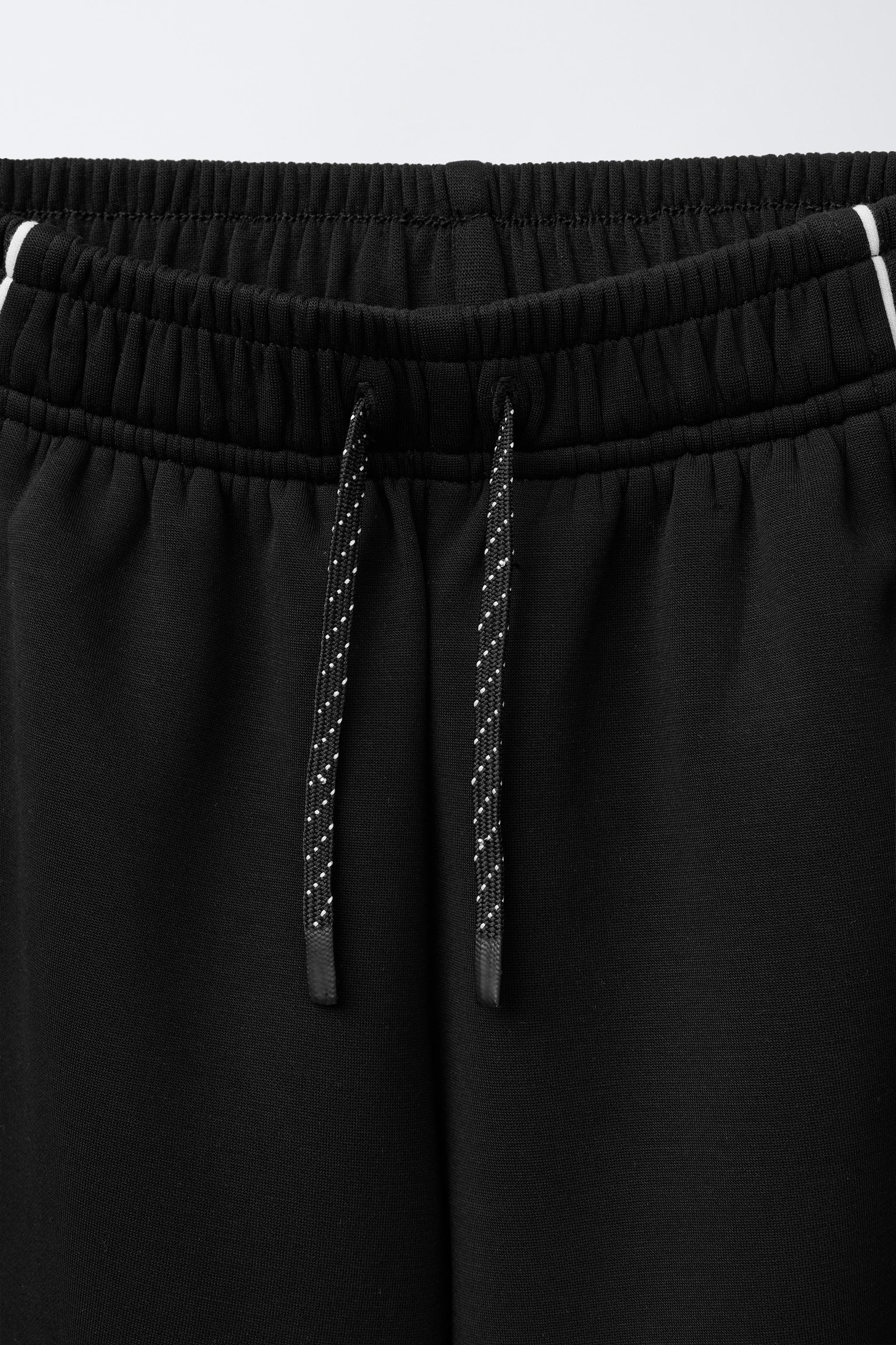 MODAL PANTS WITH CONTRASTING PIPING