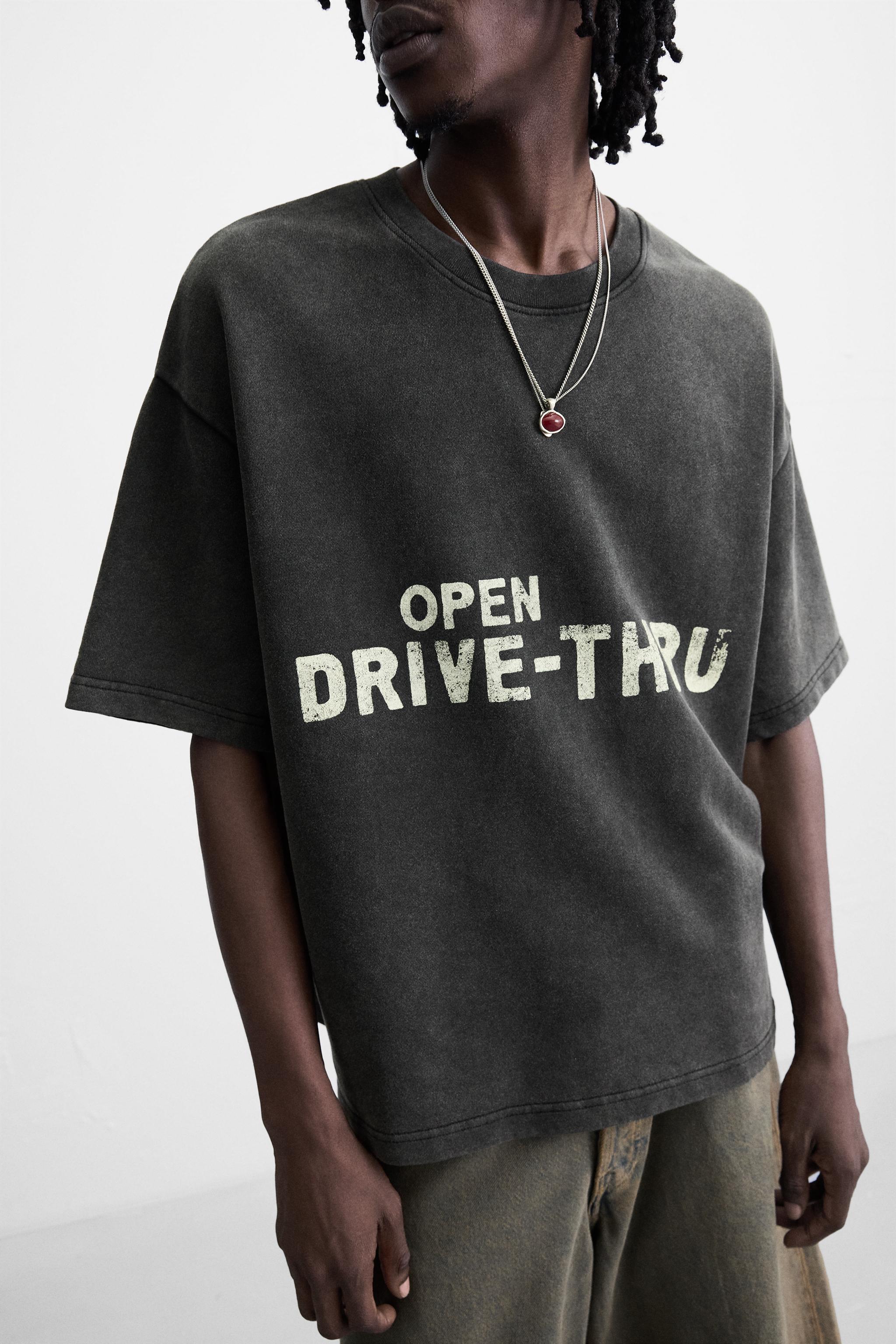 WASHED SWEATSHIRT WITH GRAPHIC PRINTS