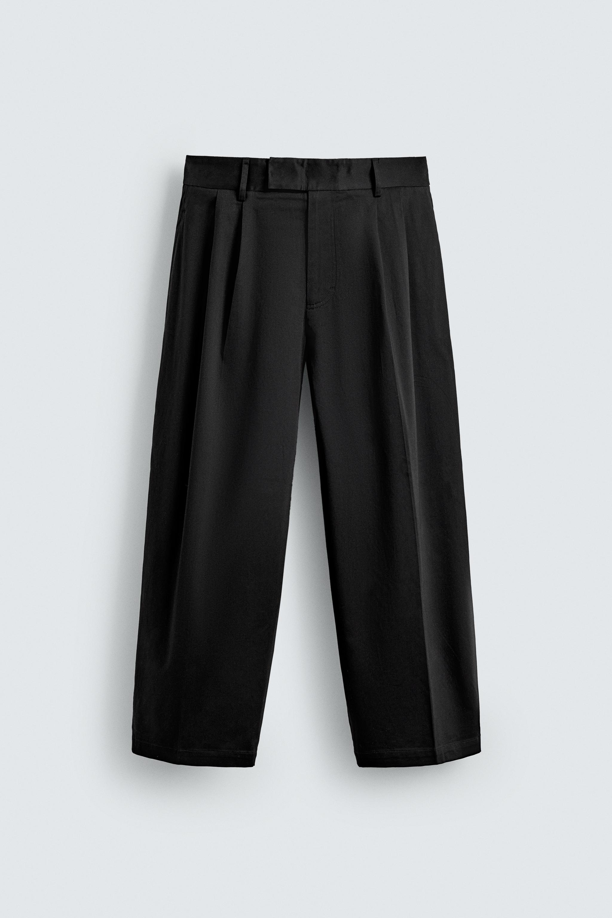 RELAXED FIT PLEATED PANTS