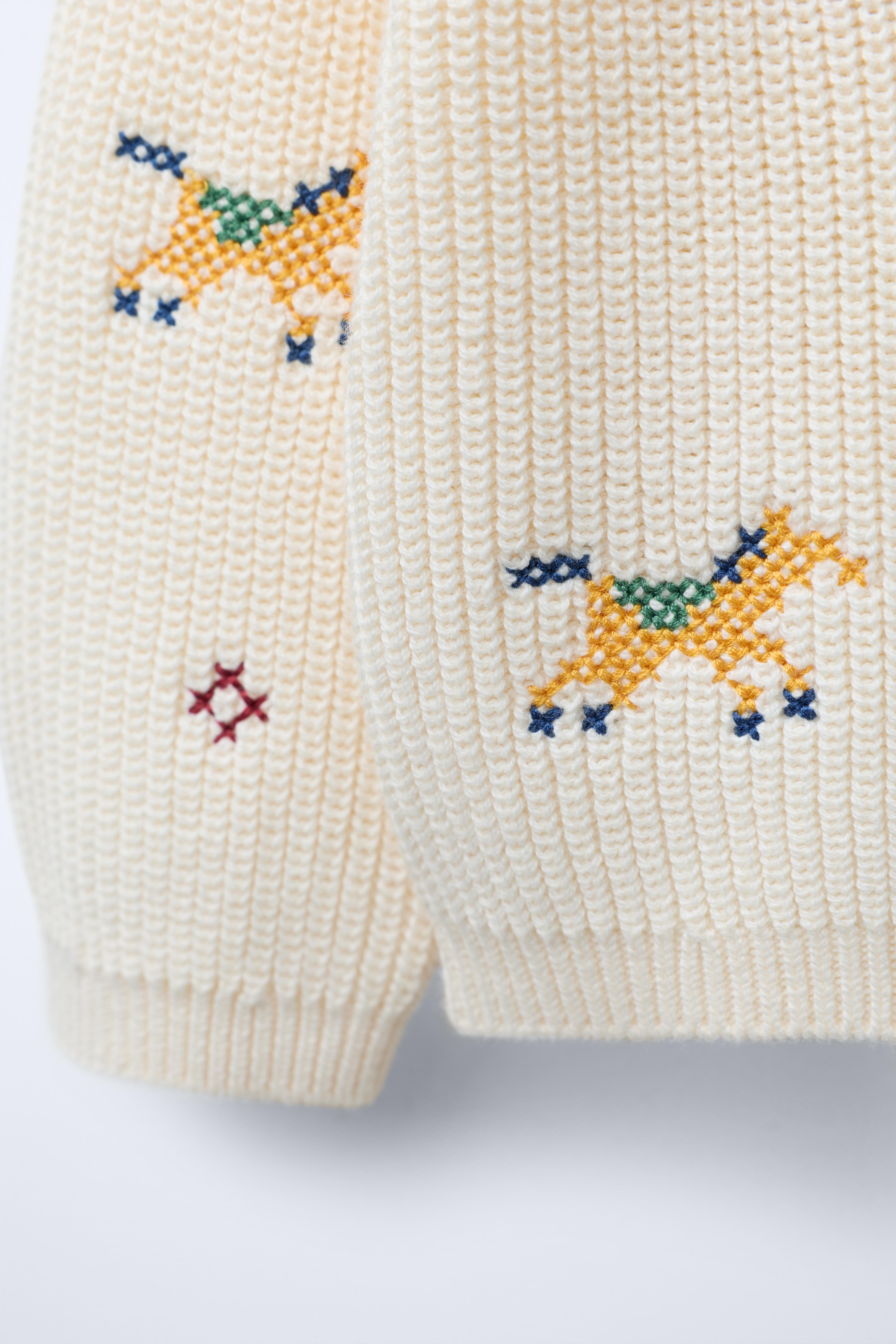 KNIT SWEATER WITH CROSS STITCH DETAILS