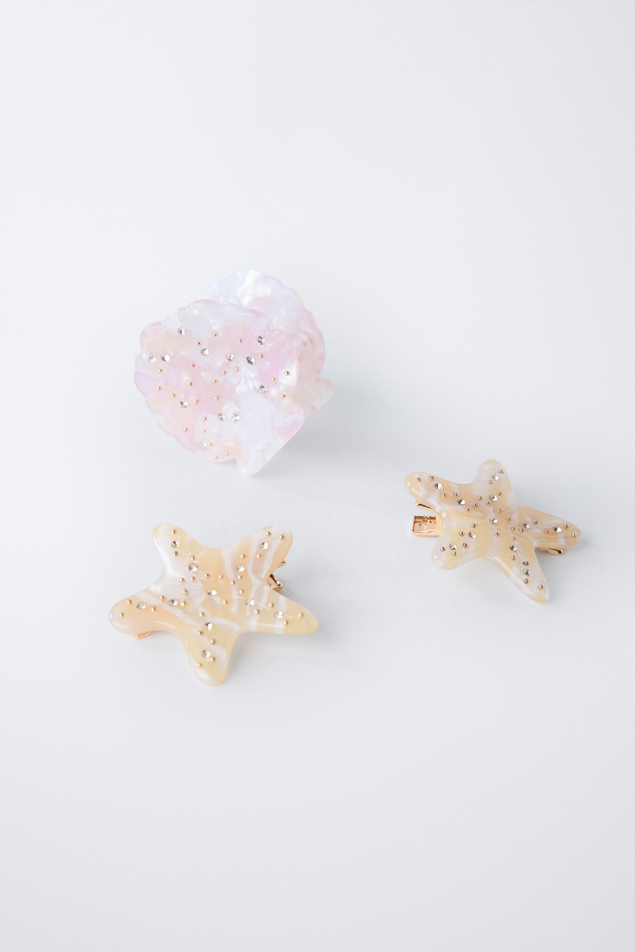 THREE-PACK OF SHELL AND STAR HAIR CLIPS