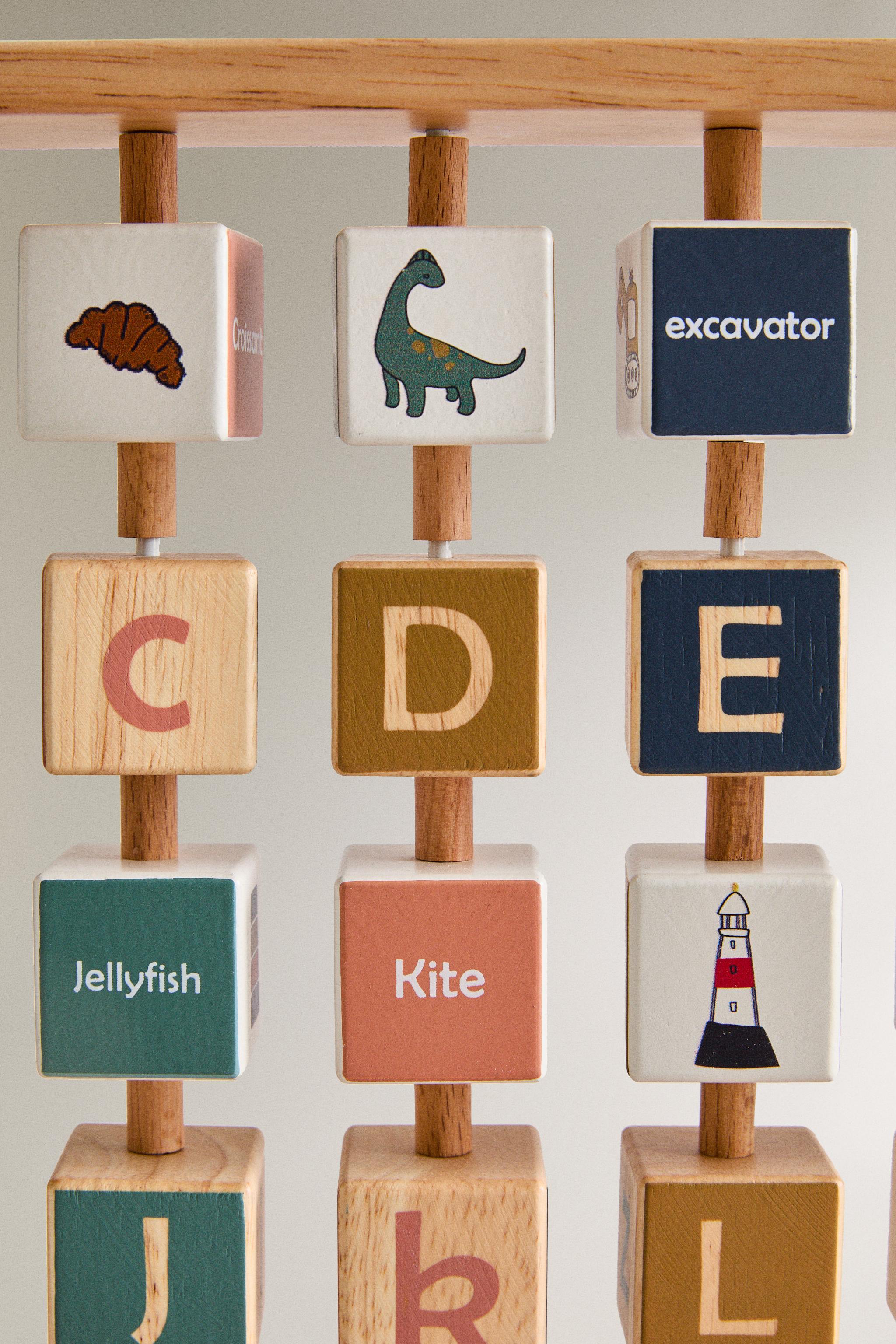 CHILDREN’S WOODEN ALPHABET TOY